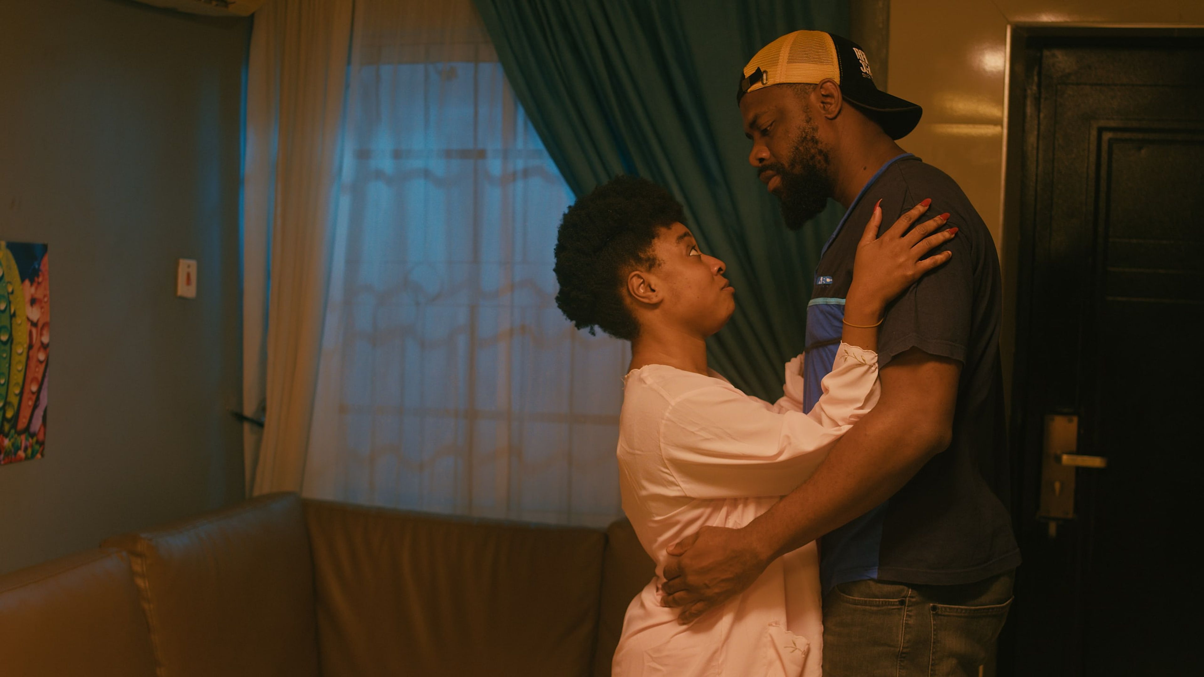 A couple embracing in a warmly lit living room