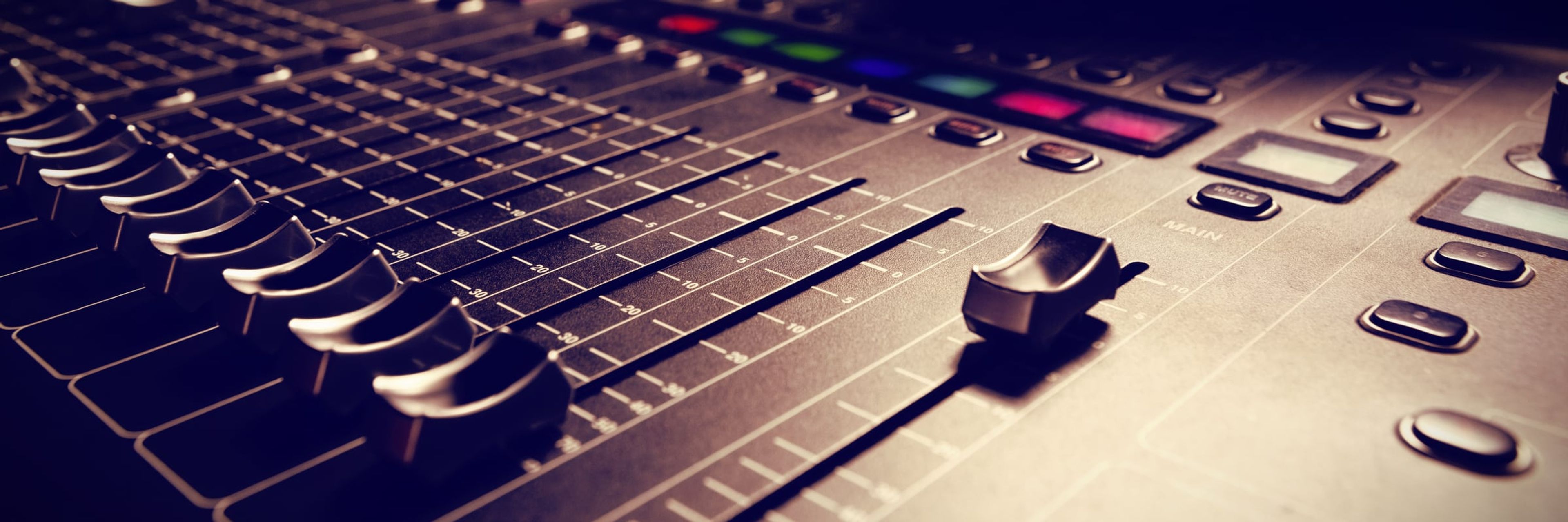 Faders on a studio mixing console