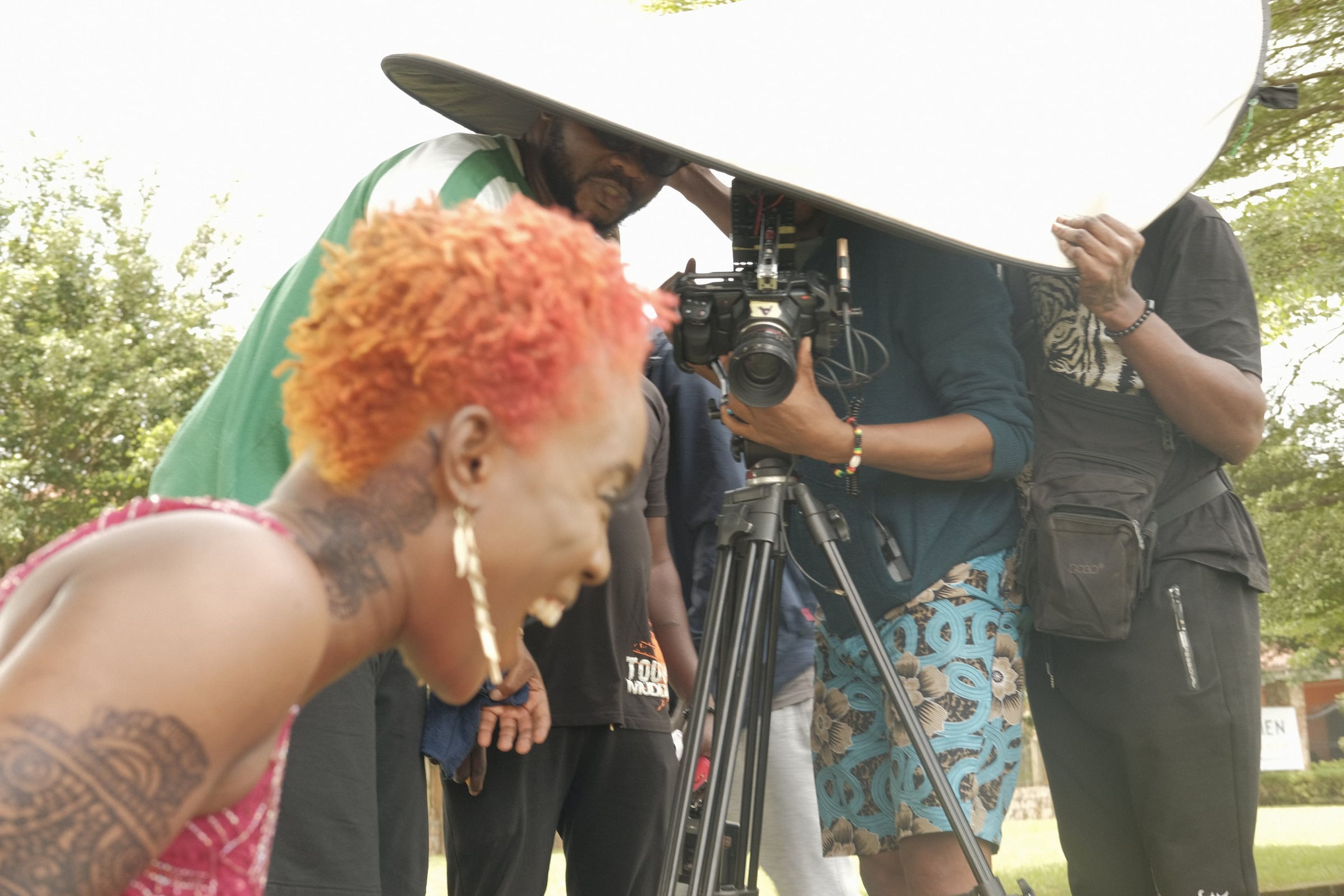 Crew filming an actor on an outdoor set