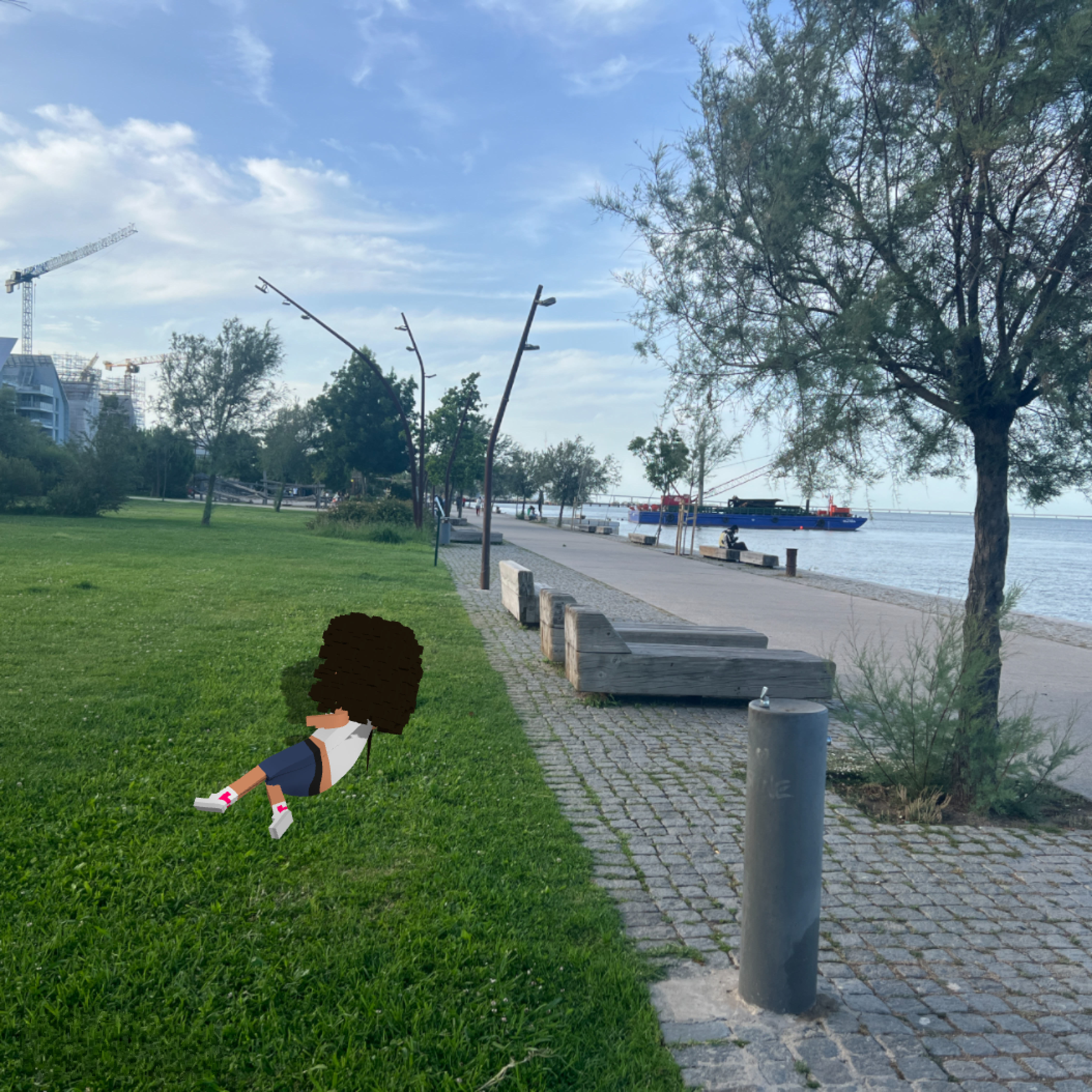 Midl sitting on the grass before visiting Eterno Gallery.