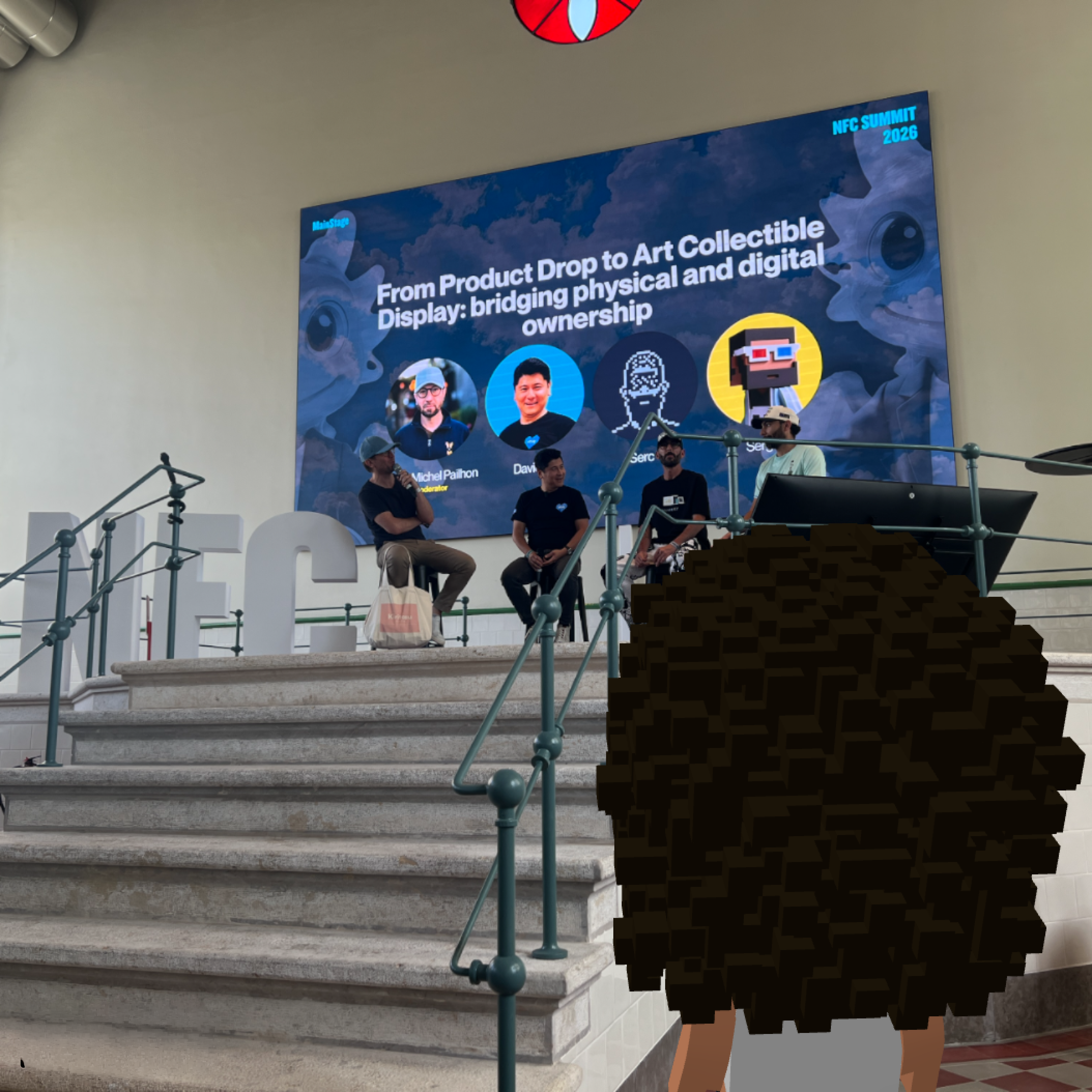 Midl in the audience during a main-stage NFC talk with Jean-Michel Pailhon, David Yu, Serc, and Sergito.
