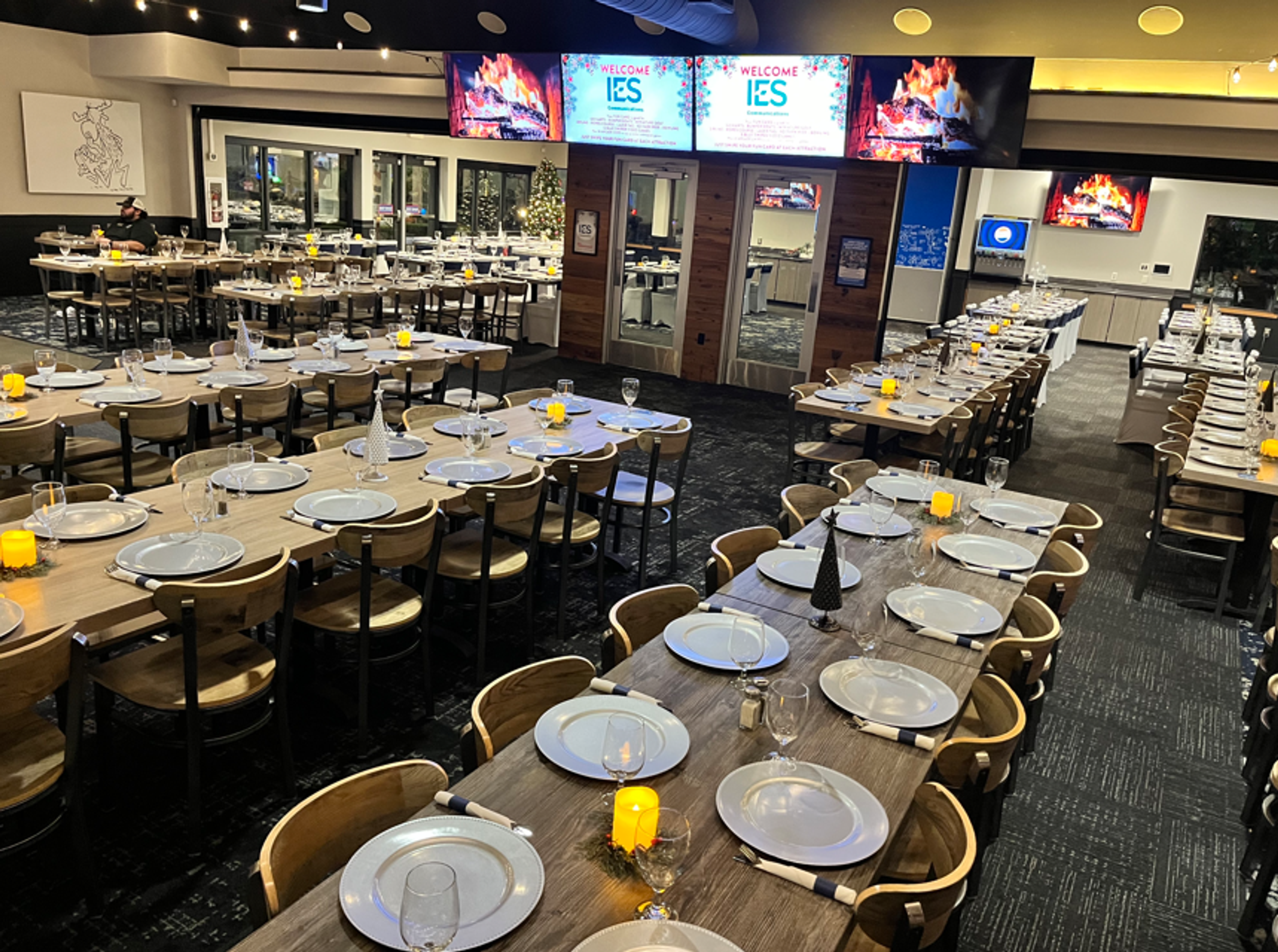 The Bullwinkle's event room set for a holiday party, long tables laid the length of the room