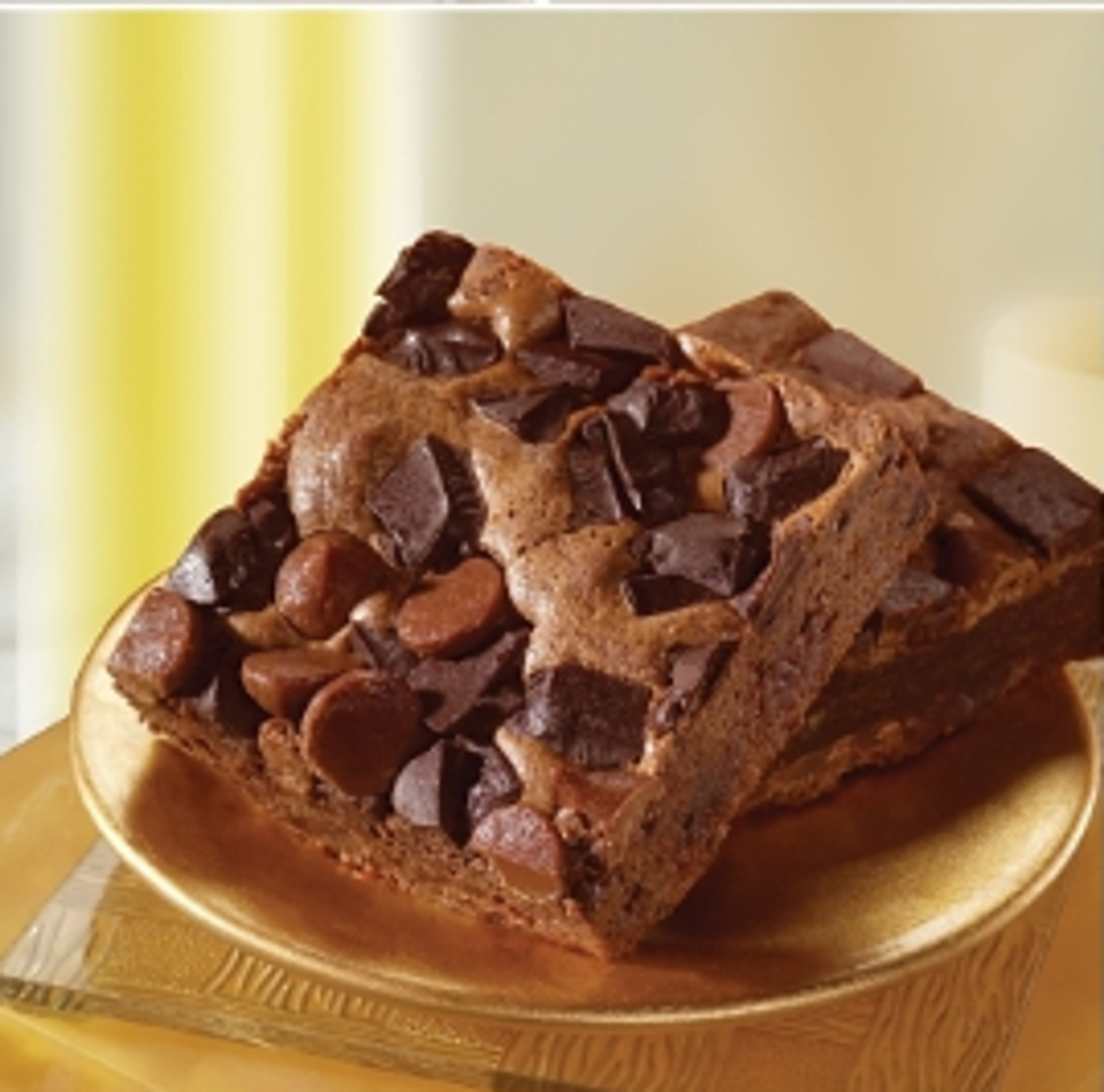 Mini chocolate brownies on a gold plate