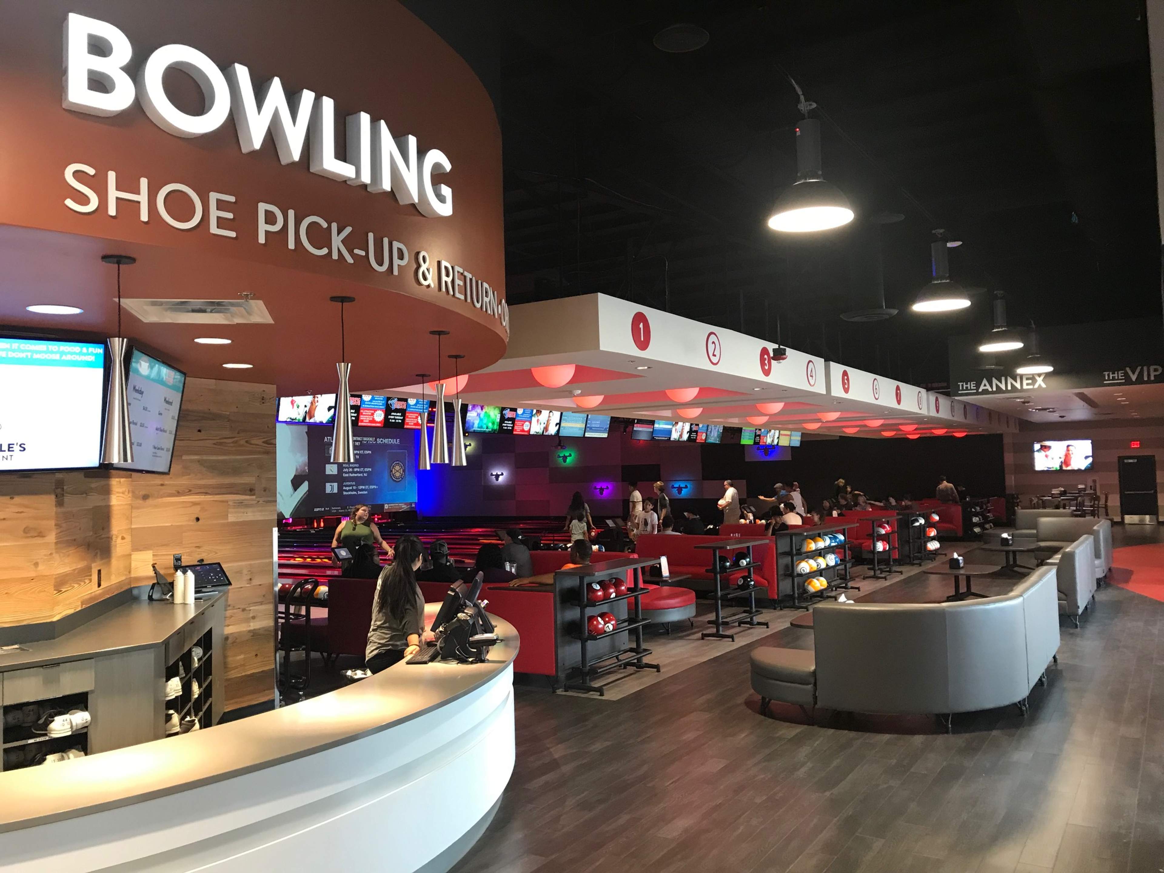 The bowling shoe pick-up counter at the front of the lanes