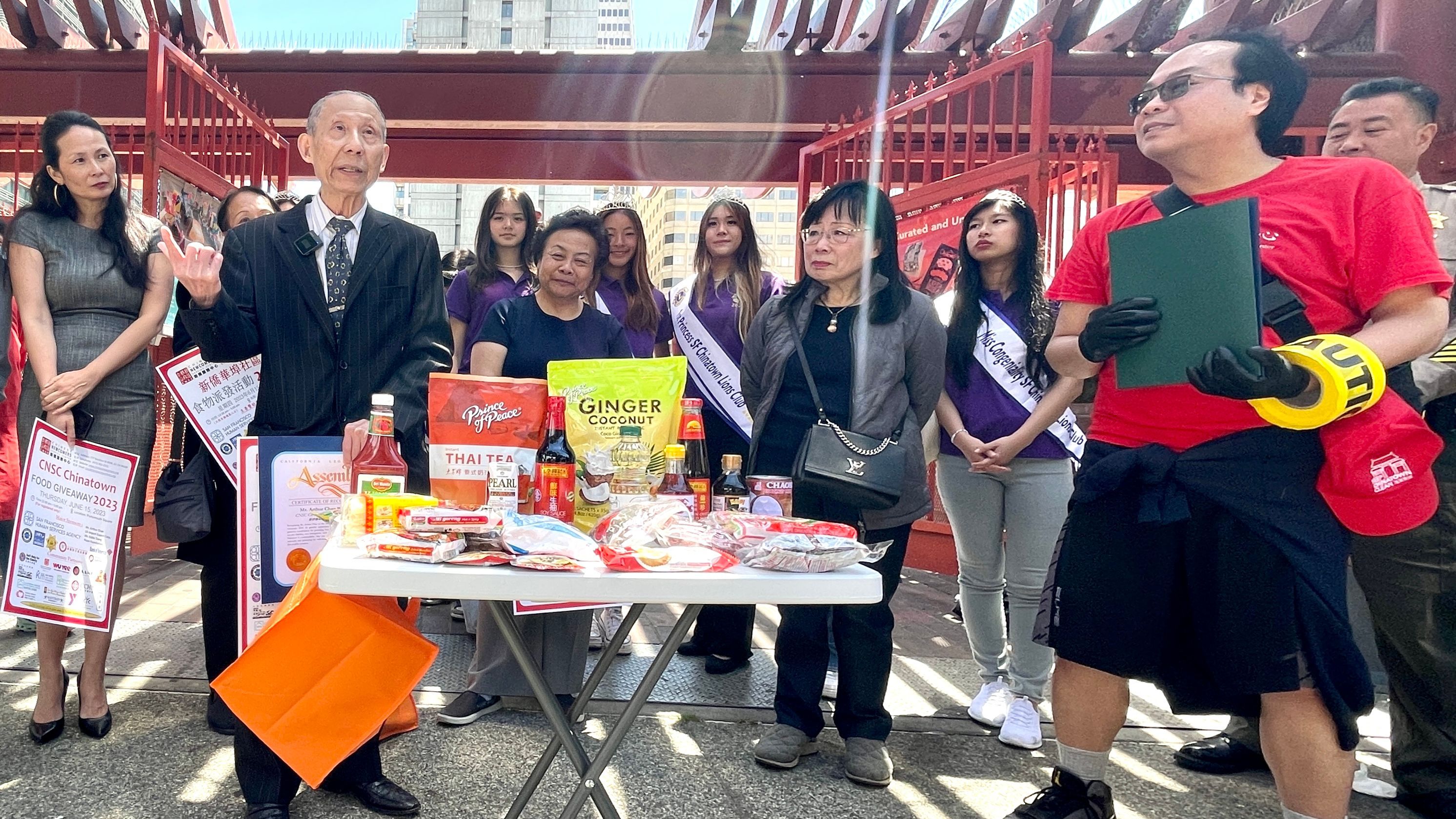 Chinese Newcomers Service Center gives away 5,000 food bags to low income families at Portsmouth Square on June 15. Each bag carries the food valued at $65. Photo by Portia Li