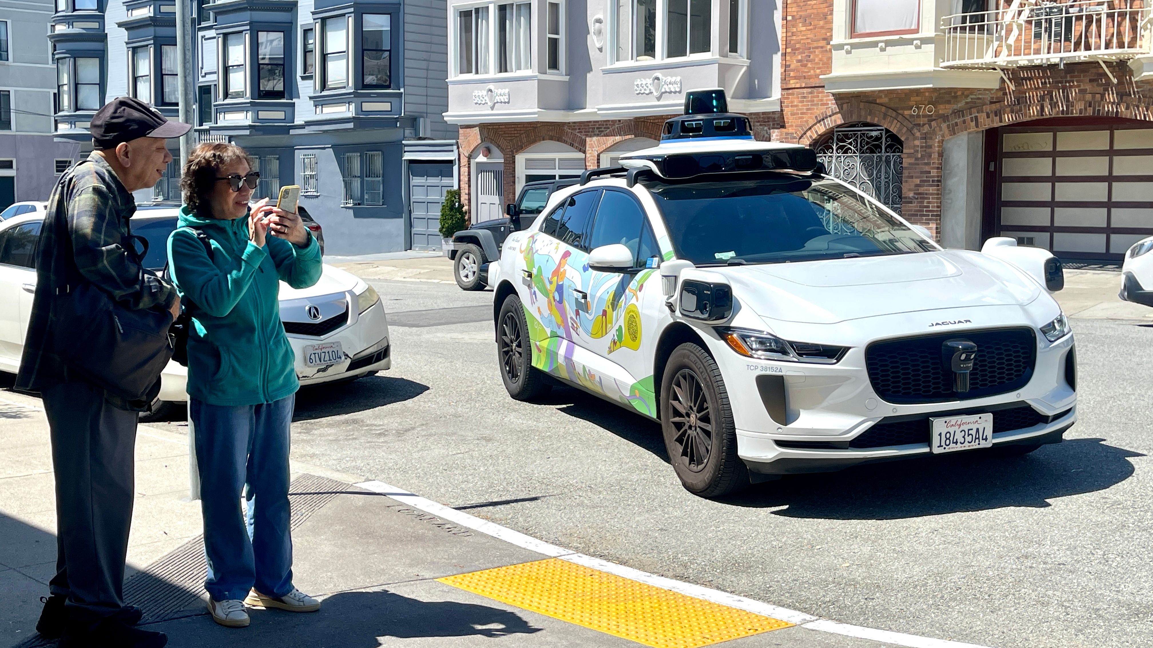 Seniors are excited to have an opportunity to be their first time to ride in a Waymo autonomous vehicle under a joint program between the Telegraph Hill Neighborhood Center in San Francisco and Waymo. Photo by Portia Li 