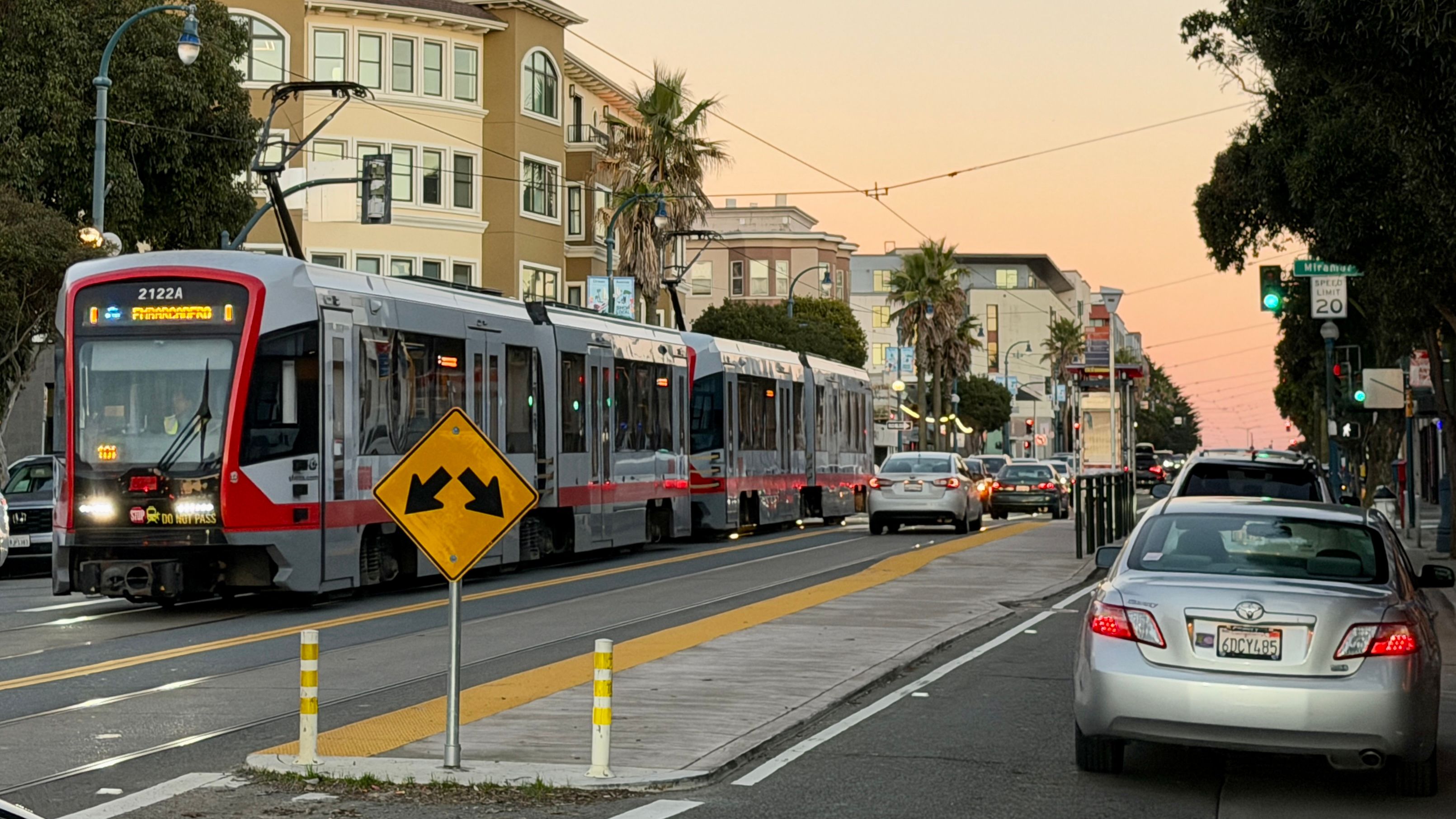 Merchants say the K trains only come every 15 to 20 minutes and the SFMTA’s plan to convert one of the two lanes in each direction on the entire Ocean Avenue along the business corridor into "red transit only” lanes at all times exclusively for K trains would unfairly impact merchants, residents, and motorists who need to share the public street for delivery, work, shopping, and medical appointments. Photo by Portia Li