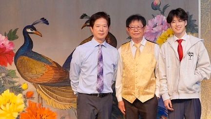 Jing Ying Institute founder Xiu Ben Chen (left), his father, Ziping Chen (center), and son, Kelan Chen (right) took a picture on stage at the premier of the talkback show. All three generations of the Chen family are inherited the Cantonese opera culture from their ancestors. The youngest Chen becomes the 6th generation to perform Cantonese opera in his family tree. Courtesy Zabrina Deng