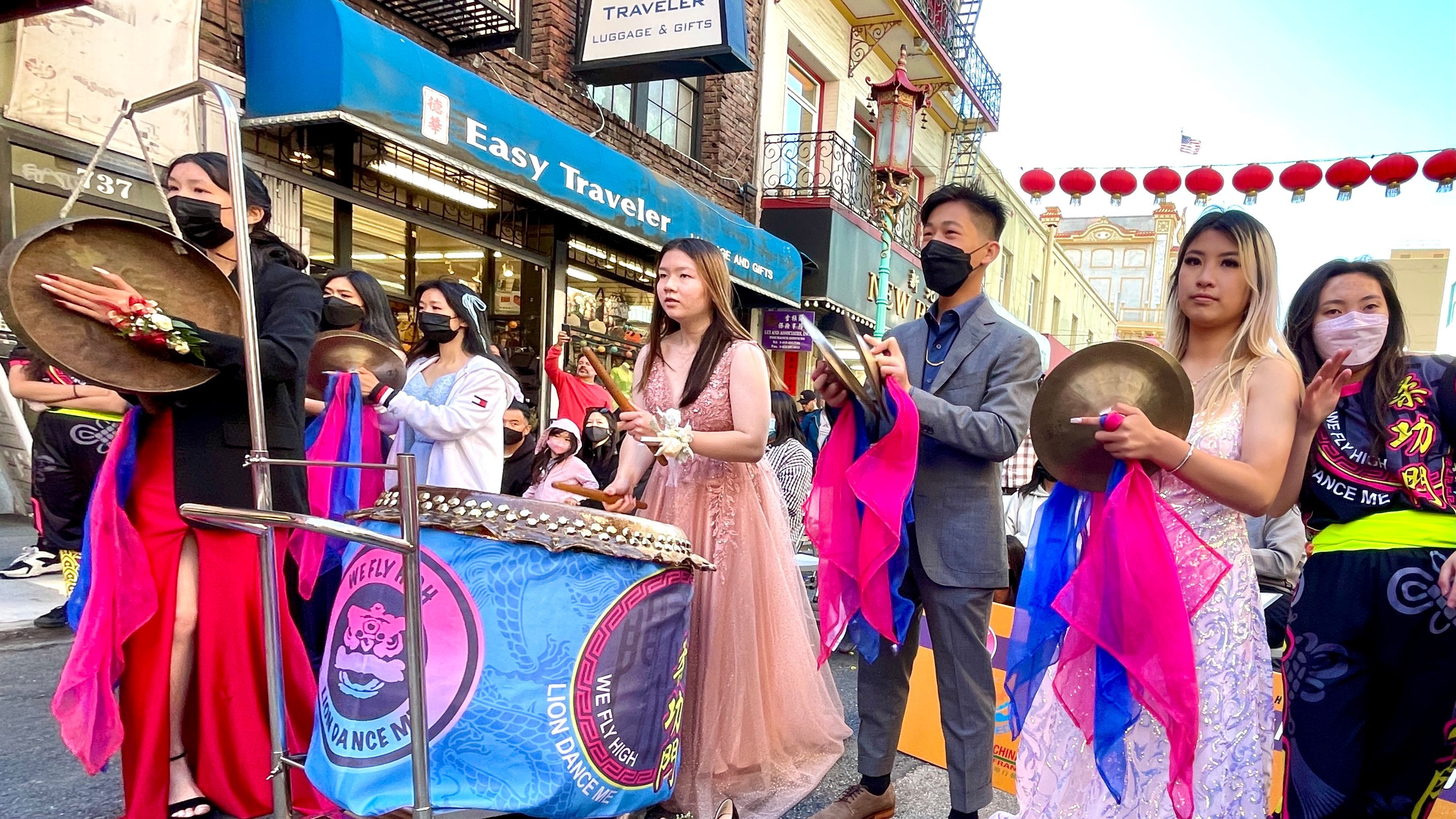 Team members, Ananda Tang Lee(from left to the right), Isabella Yu, Anthony Huang, and Jennifer Guan, are honored at the awards ceremony. They wear suits and gowns joining the lion dance performance. Photo by Portia Li