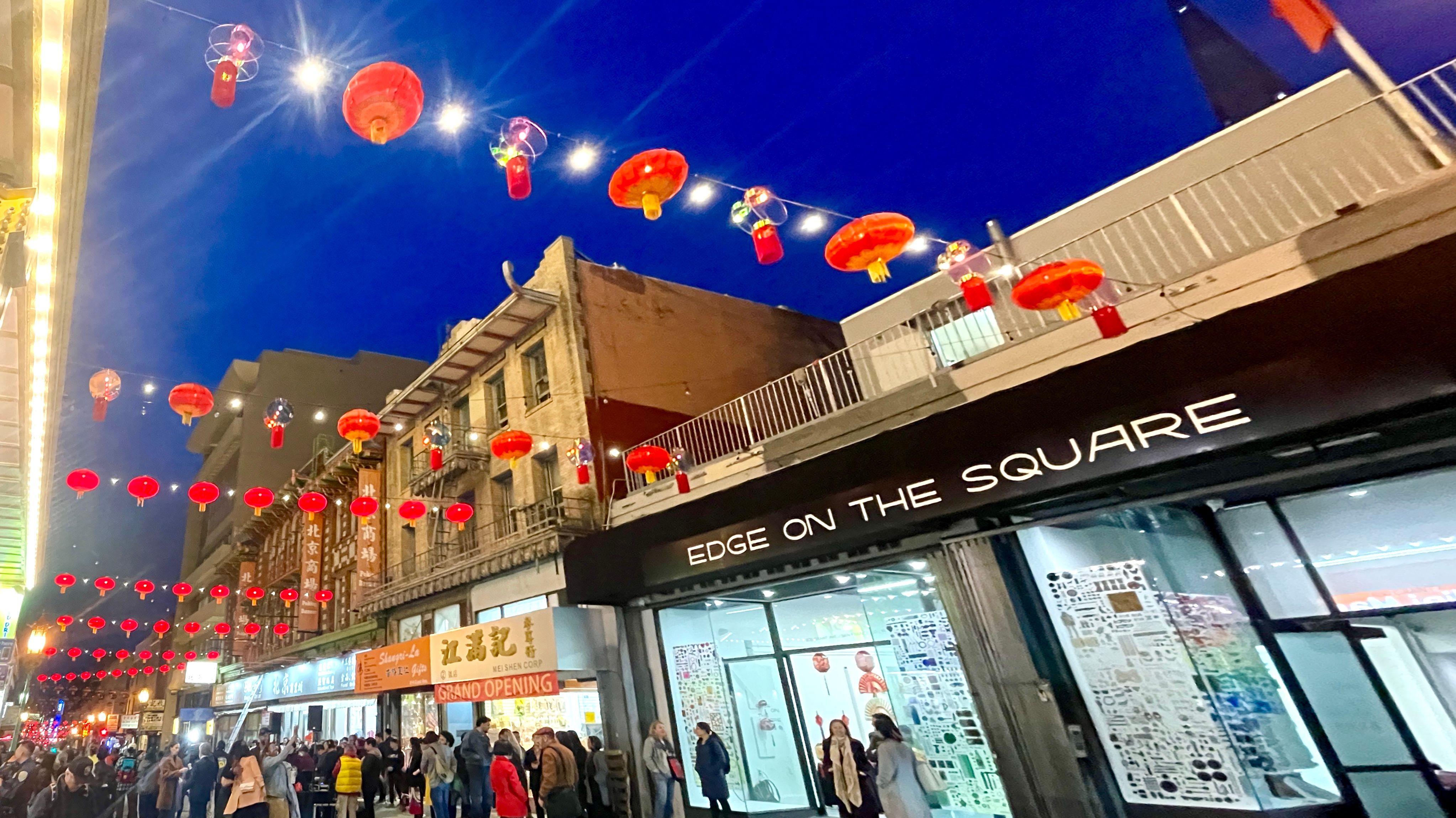 Prismatic Shift lanterns are installed between the traditional red lanterns outside Edge on the Square to light up San Francisco Chinatown. Photo by Portia Li