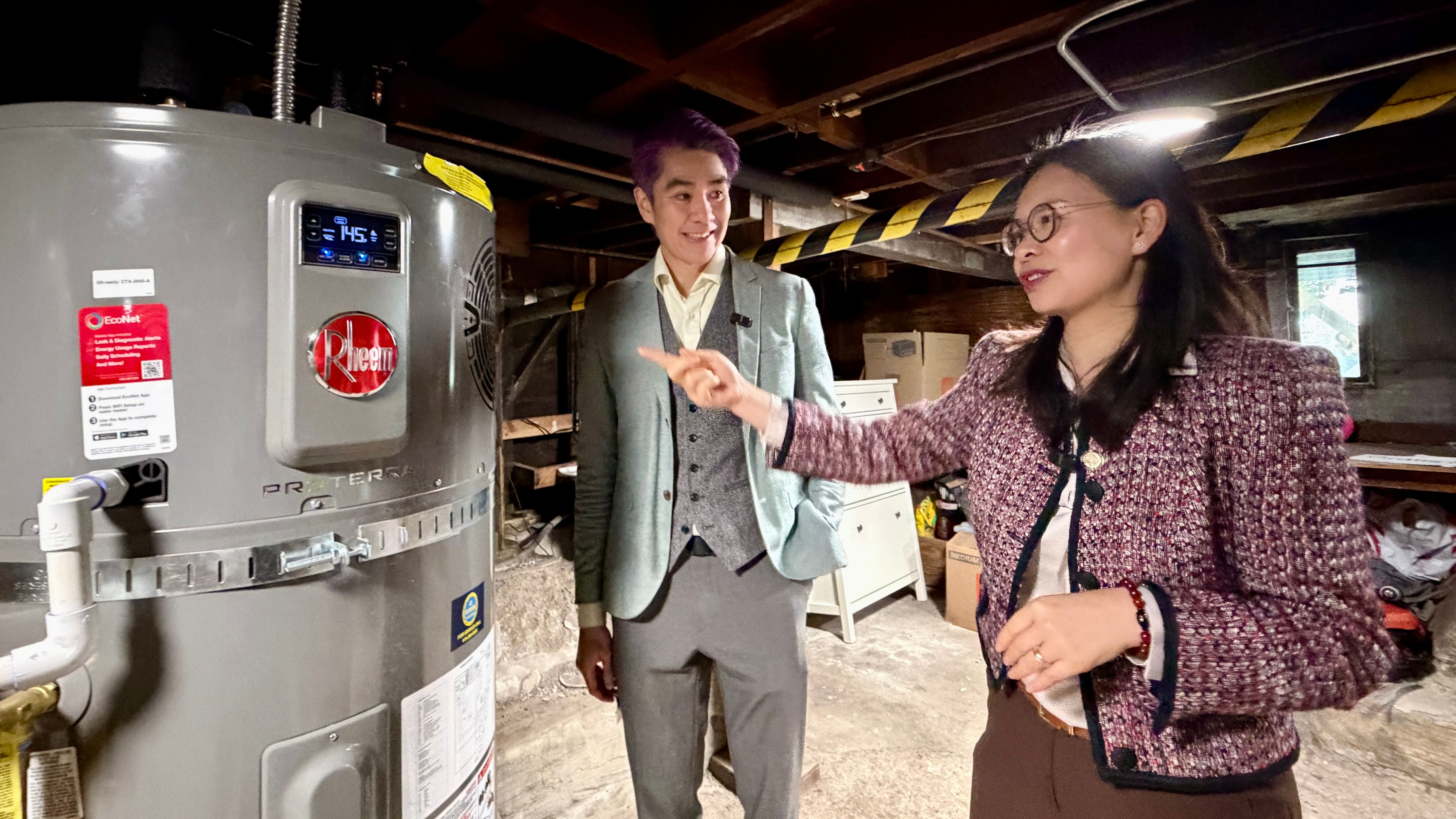 Director of the San Francisco Environment Department Tyrone Jue (left) and District 11 Supervisor Chyanne Chen promote heat pump water heater technology to have cleaner air and save energy usage. Photo by Portia Li