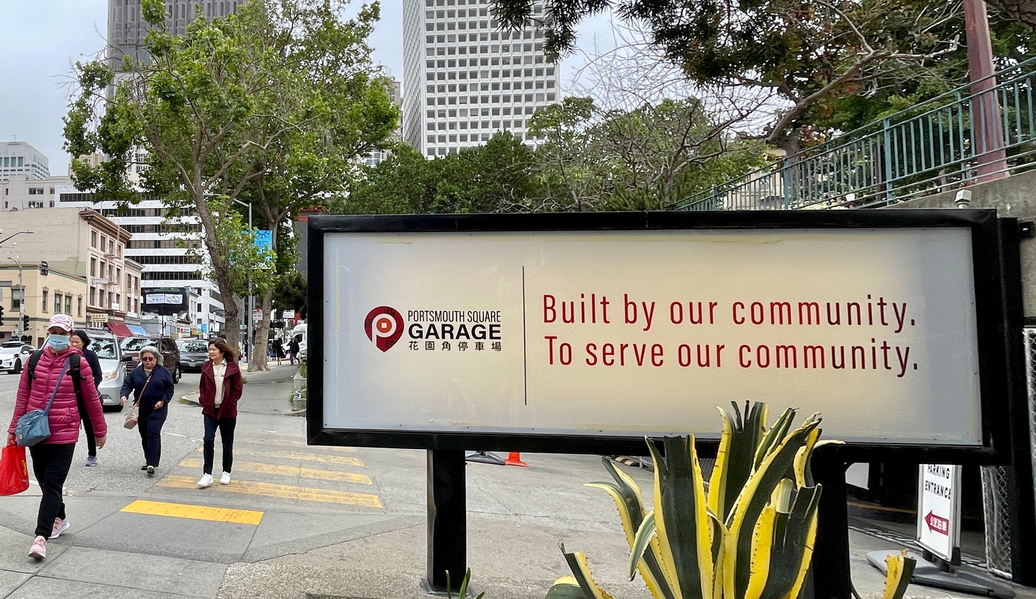 New signage at the Portsmouth Square Garage entrance delivers new messages at both sides to welcome Chinatown visitors.  Photo by Portia Li