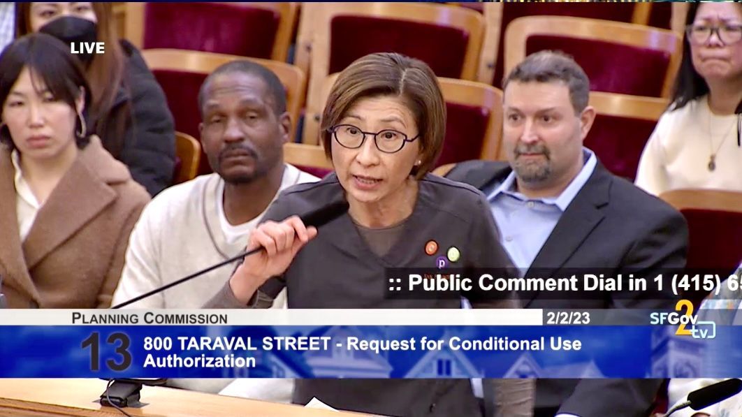 Pediatric dentist Dorothy Pang speaks in the Planning Commission hearing to oppose the Gold Mirror cannabis store. Three partners of the dispensary ownership sit behind Pang. Screenshot