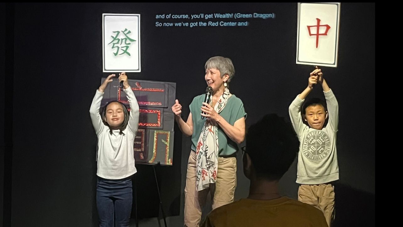 Kim Konami (center) rehearses the “Story of Mahjong” segment in Canto Pride with Haily Wong (left) and Justin Louie (right) under the supervision of Director Cruz Chan. Photo by Joseph Woo Chan