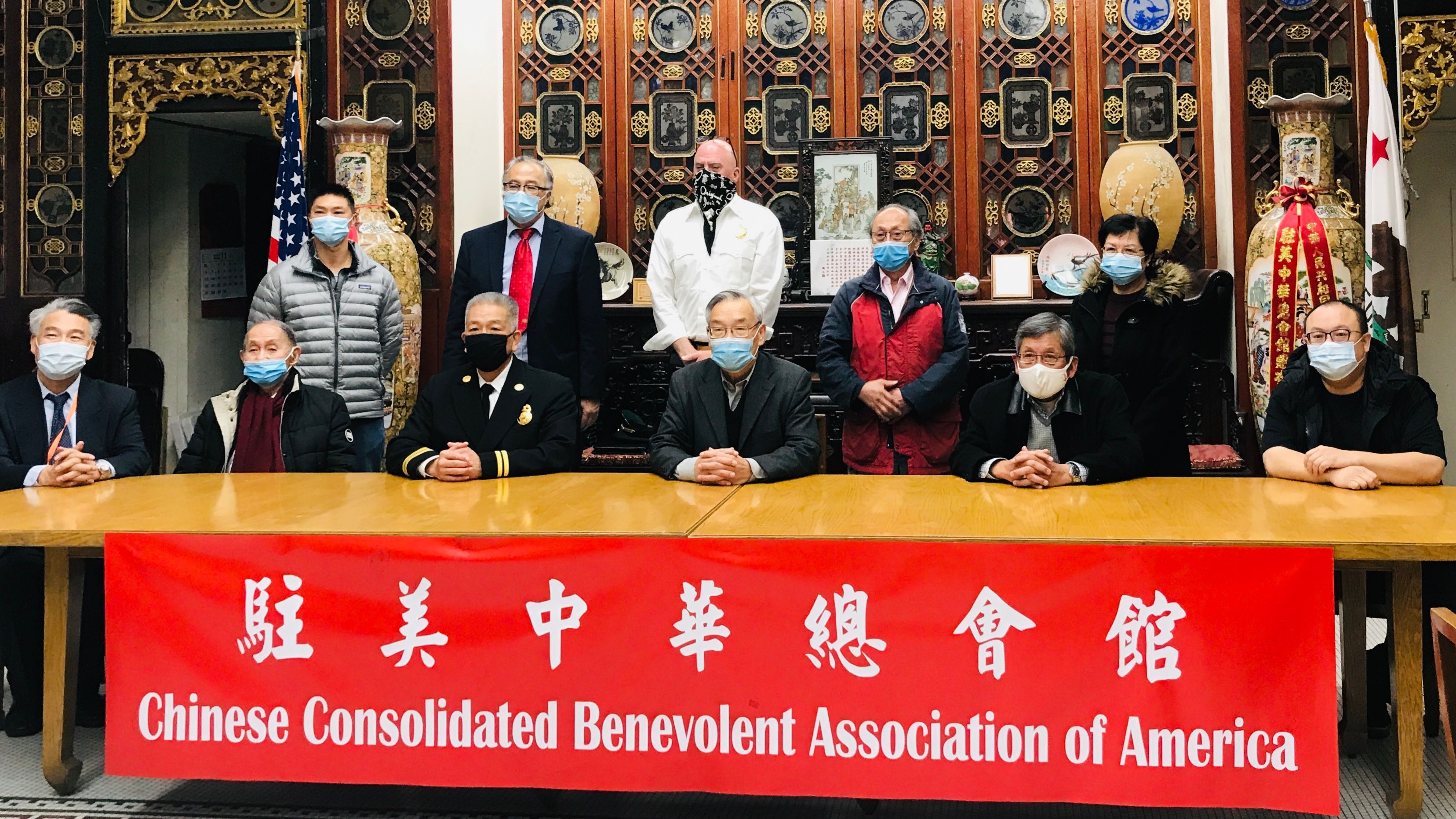 A group of community leaders gathered in Chinatown to urge the city promoting more Chinese American firefighters to management positions. Ken Yee(front row third from left) is recently promoted to Acting Assistant Fire Chief. Photo by Portia Li