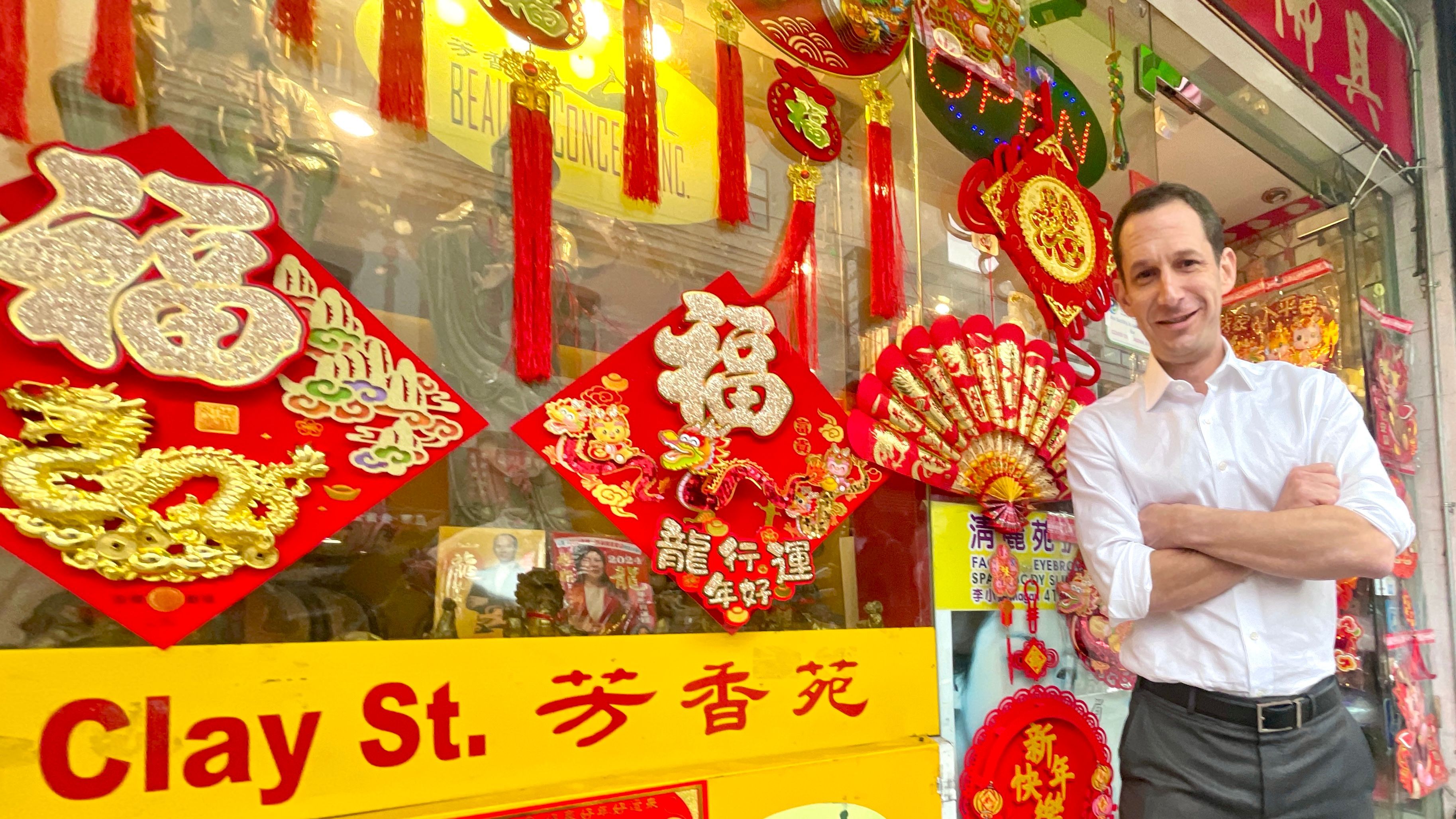 San Francisco mayoral candidate Daniel Lurie walks through Chinatown to meet with merchants and welcome the upcoming Lunar New Year. Photo by Portia Li