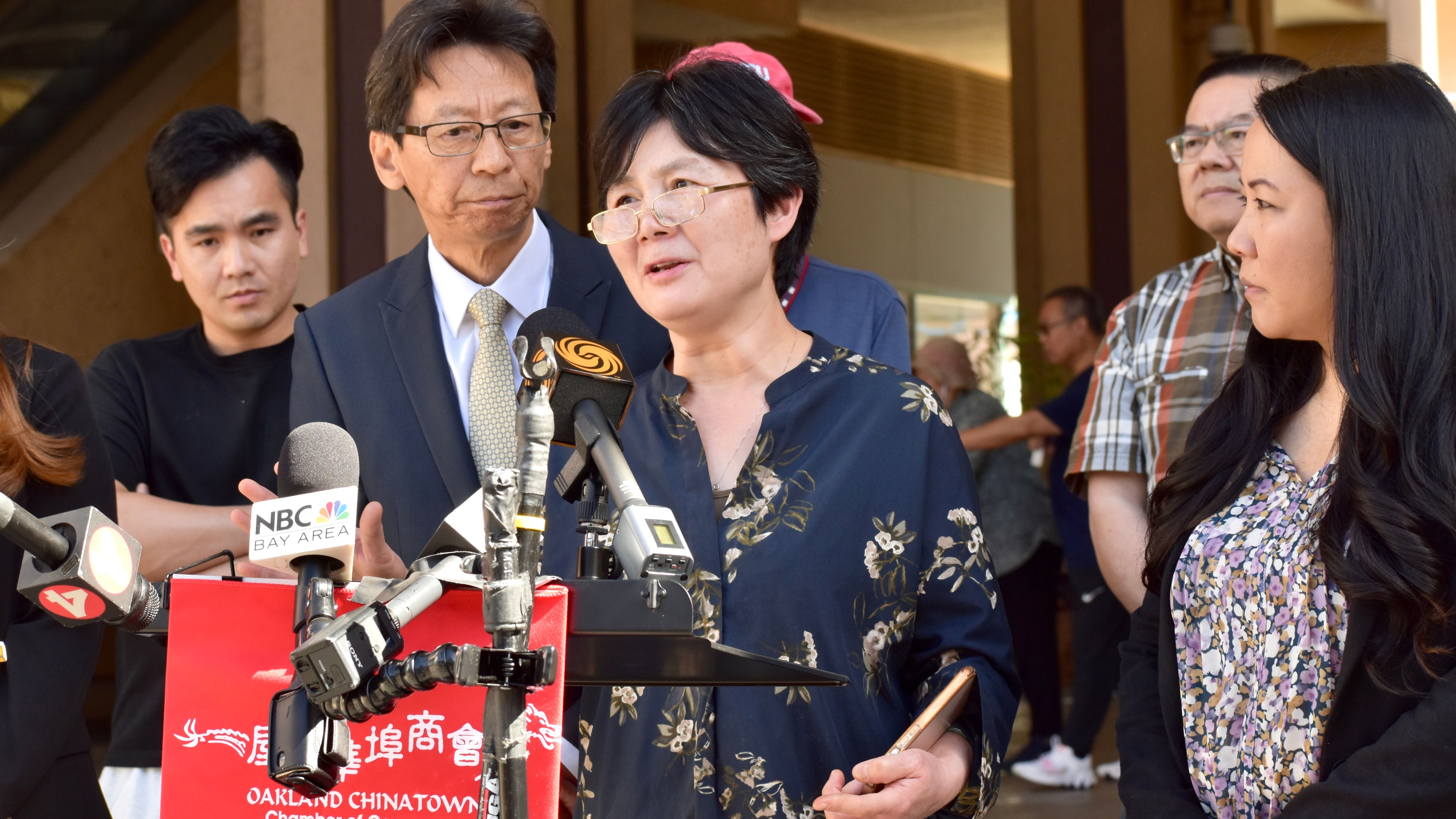 The Oakland Chinatown Chamber of Commerce and local business owners hold a press conference at Pacific Renaissance Plaza to address the alarming rise in smash-and-grab robberies in Oakland Chinatown. Grocery store owner Shirley Luo ( speaker) demands more police presence to protect shoppers and merchants. Photo by Portia Li