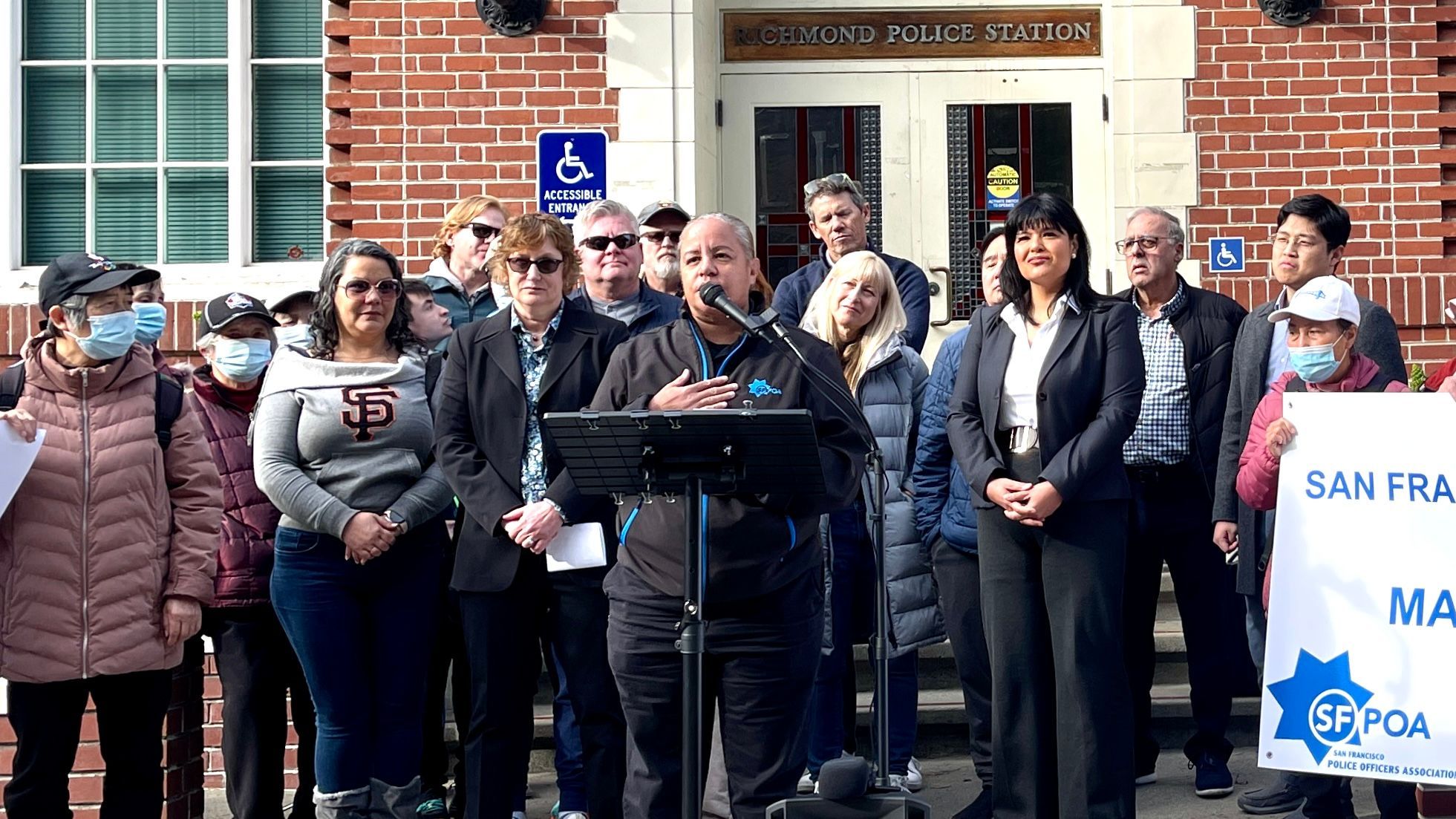 San Francisco Police Officers Association President Tracy McCray (center) speaks at a press conference in front of Richmond Police Station to endorse D1 Supervisor candidate Marjan Philhour. Photo by Portia Li