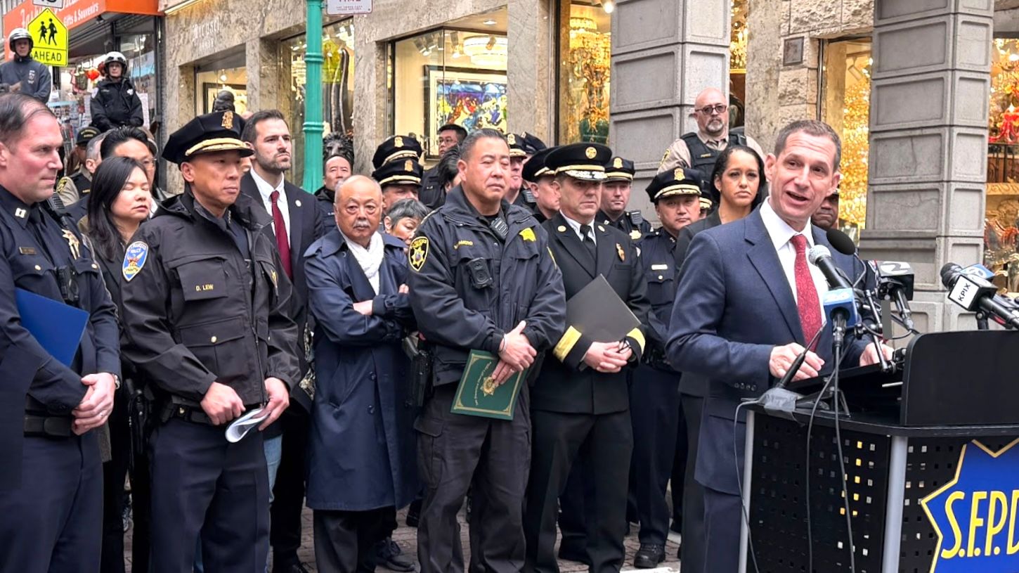 Mayor Daniel Lurie (front) and representatives from public safety agencies announce at the Chinatown Gate the City’s enhanced crime prevention and deployment during Lunar New Year. Photo by Portia Li