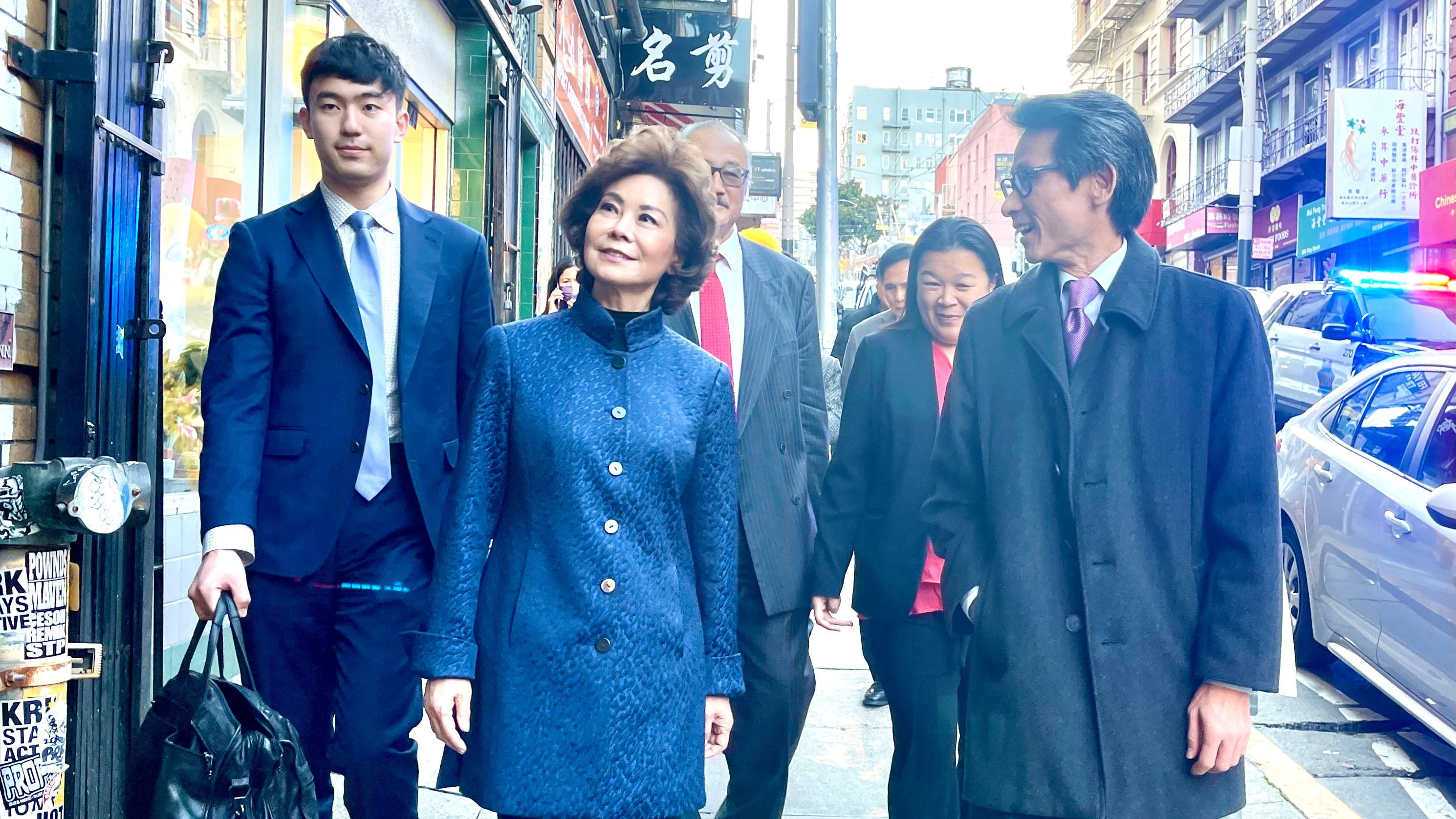 Former Secretary of Transportation Elaine Chao (center) comes back to visit San Francisco Chinatown and walks through Chinatown with CCBA leaders. Photo by Portia Li /