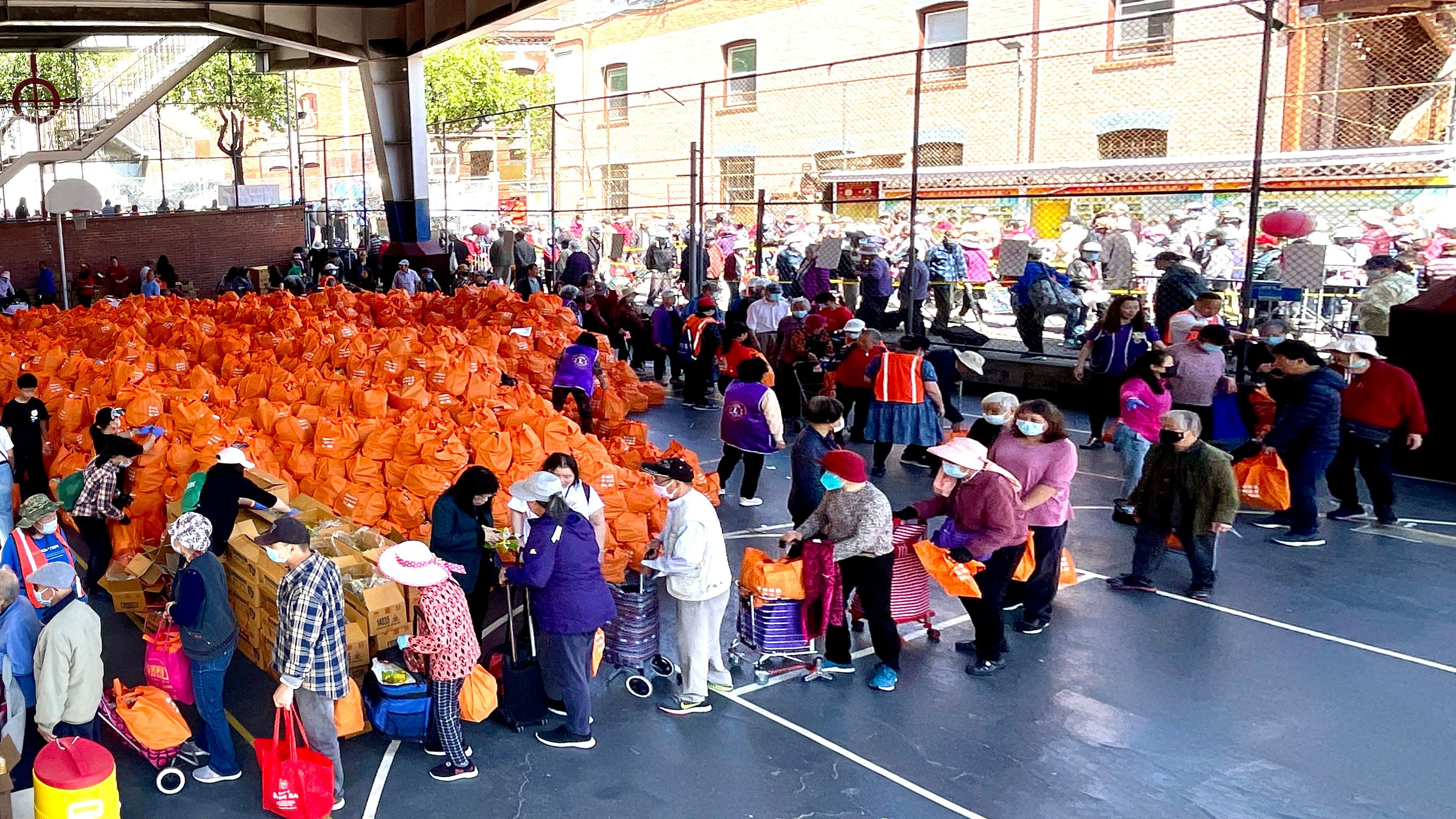 The annual 5,000-bag food drive organized by the Chinese Newcomers Service Center has become one of the largest food events in San Francisco. Photo by Portia Li