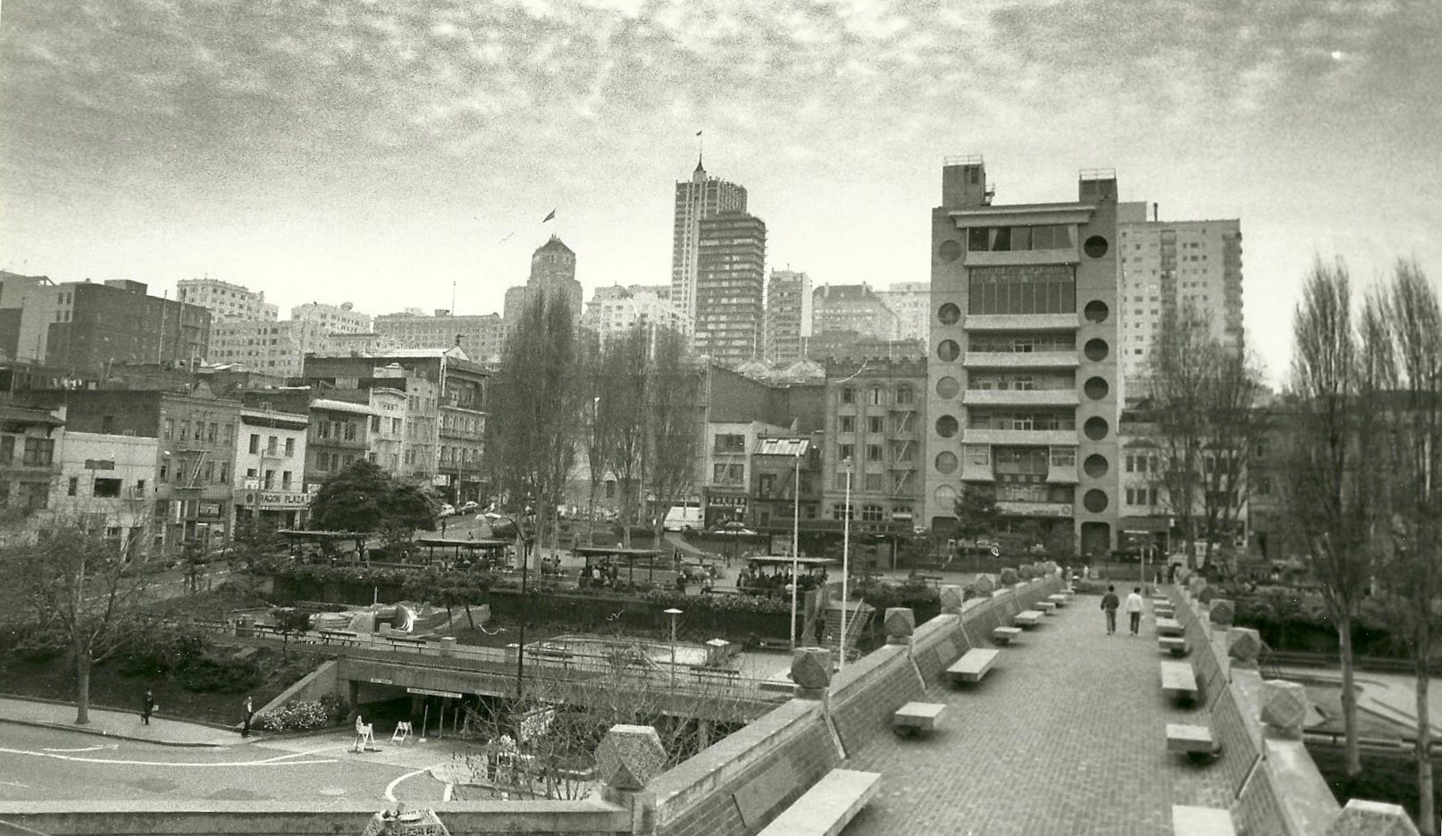 The historic Portsmouth Square pedestrian bridge elevated over Kearny Street was opened in 1971. The bridge was funded and built by the Chinese community. The City of San Francisco has failed to preserve the landmark bridge which will be torn down soon. Photo by Ben Kwan