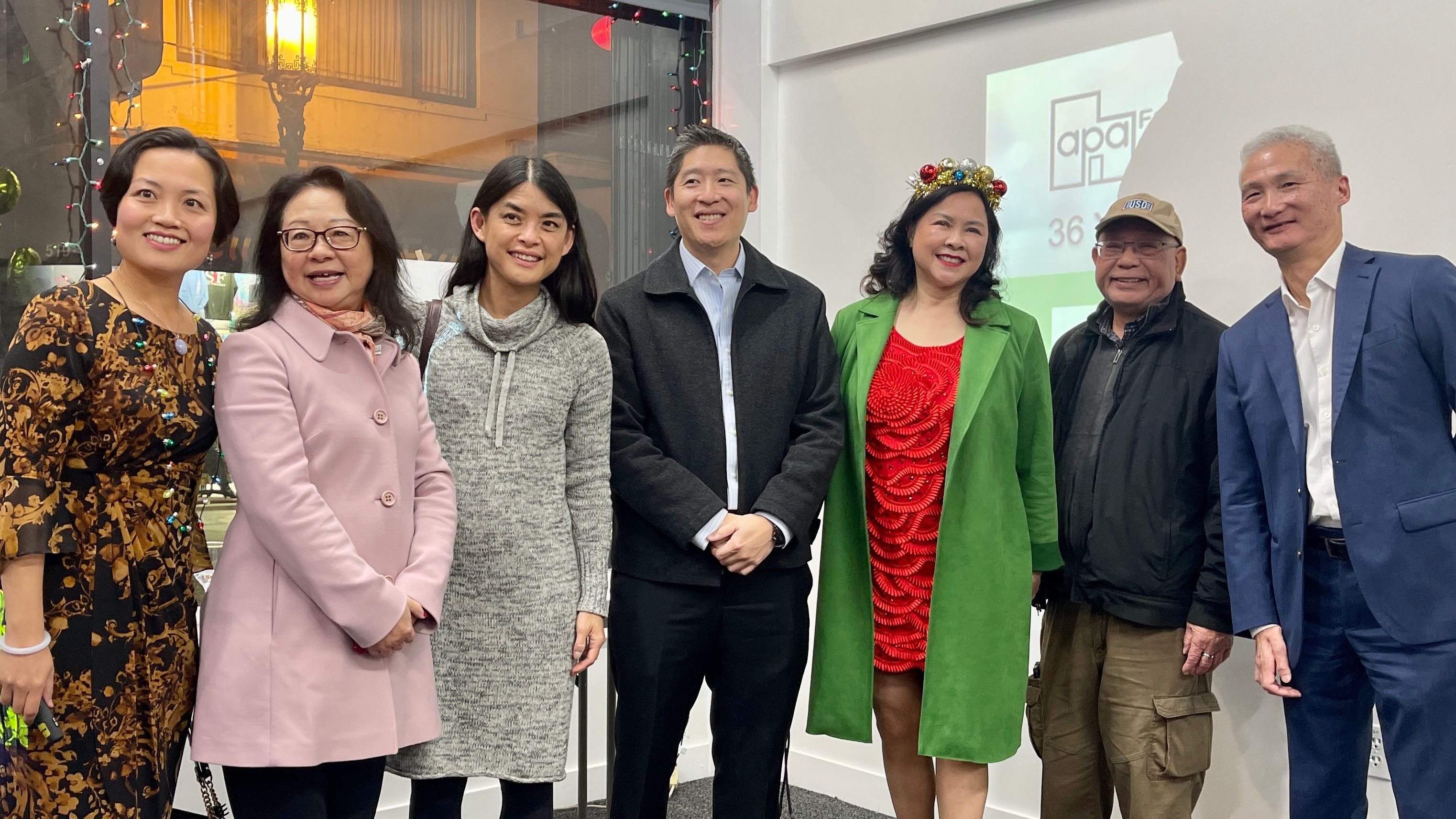 APA Family Support Services (APAFSS) Executive Director Fanny Lam (first from far left) and board members celebrate the opening of Family Resource Center in San Francisco Chinatown. Photo by Portia Li