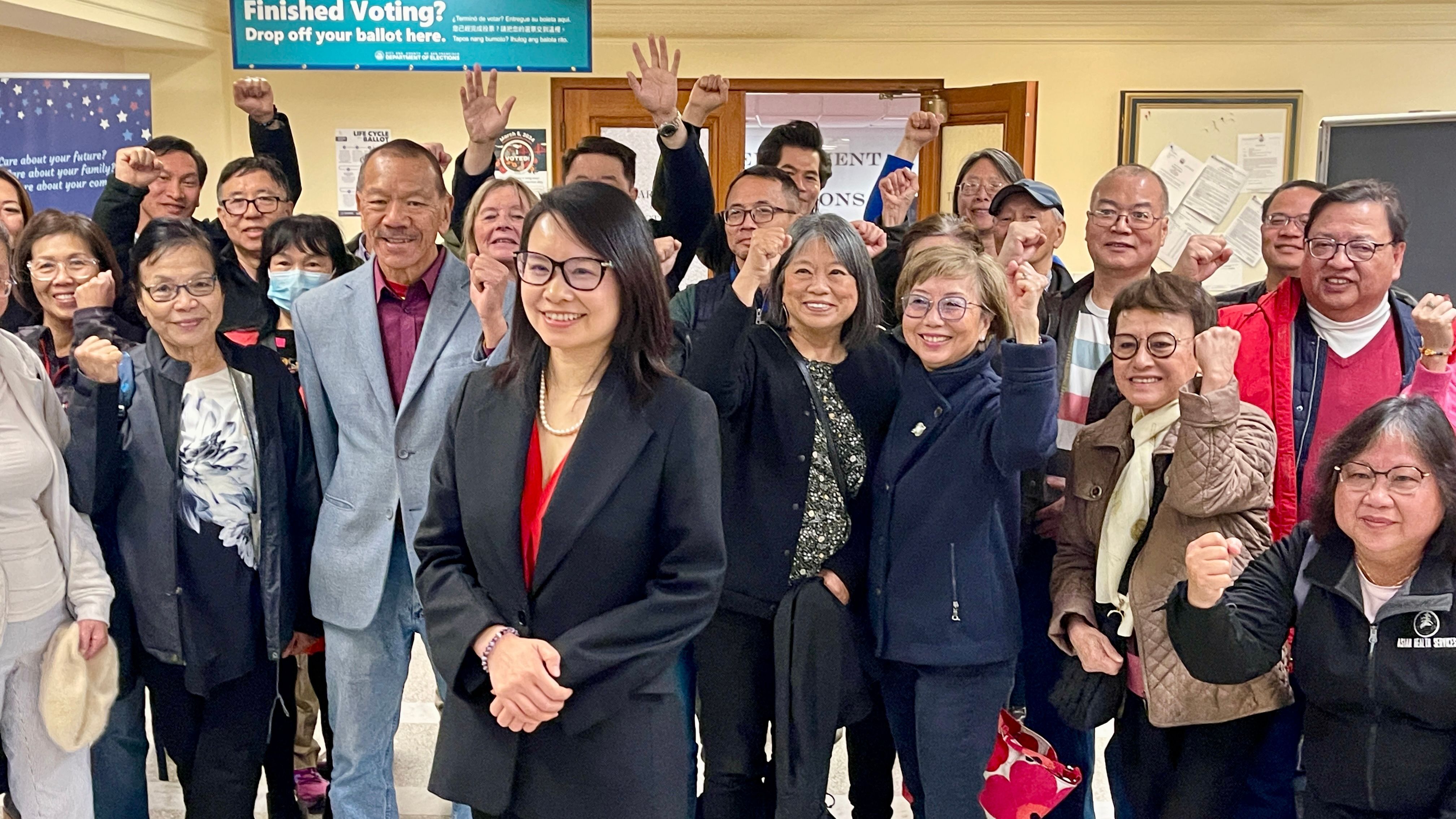 Labor union activist Chyanne Chen (center in front) announces her candidacy for District 11 Supervisor at the Department of Elections. Photo by Portia Li