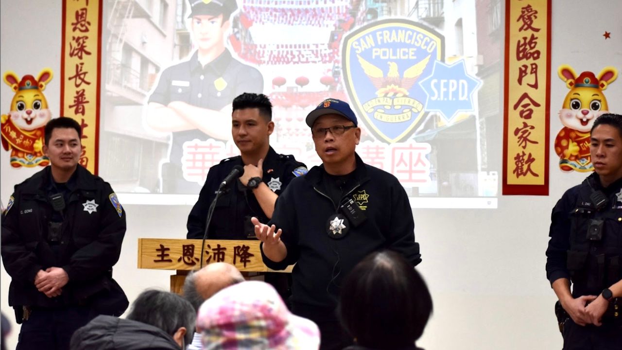 For many years, Chinese speaking police officers Curren Gong (from left), William Ma, Eddie Wu and Loren Chiu have spoken to seniors in Chinatown to provide crime prevention tips during the Chinese New Year. Photo by Portia Li