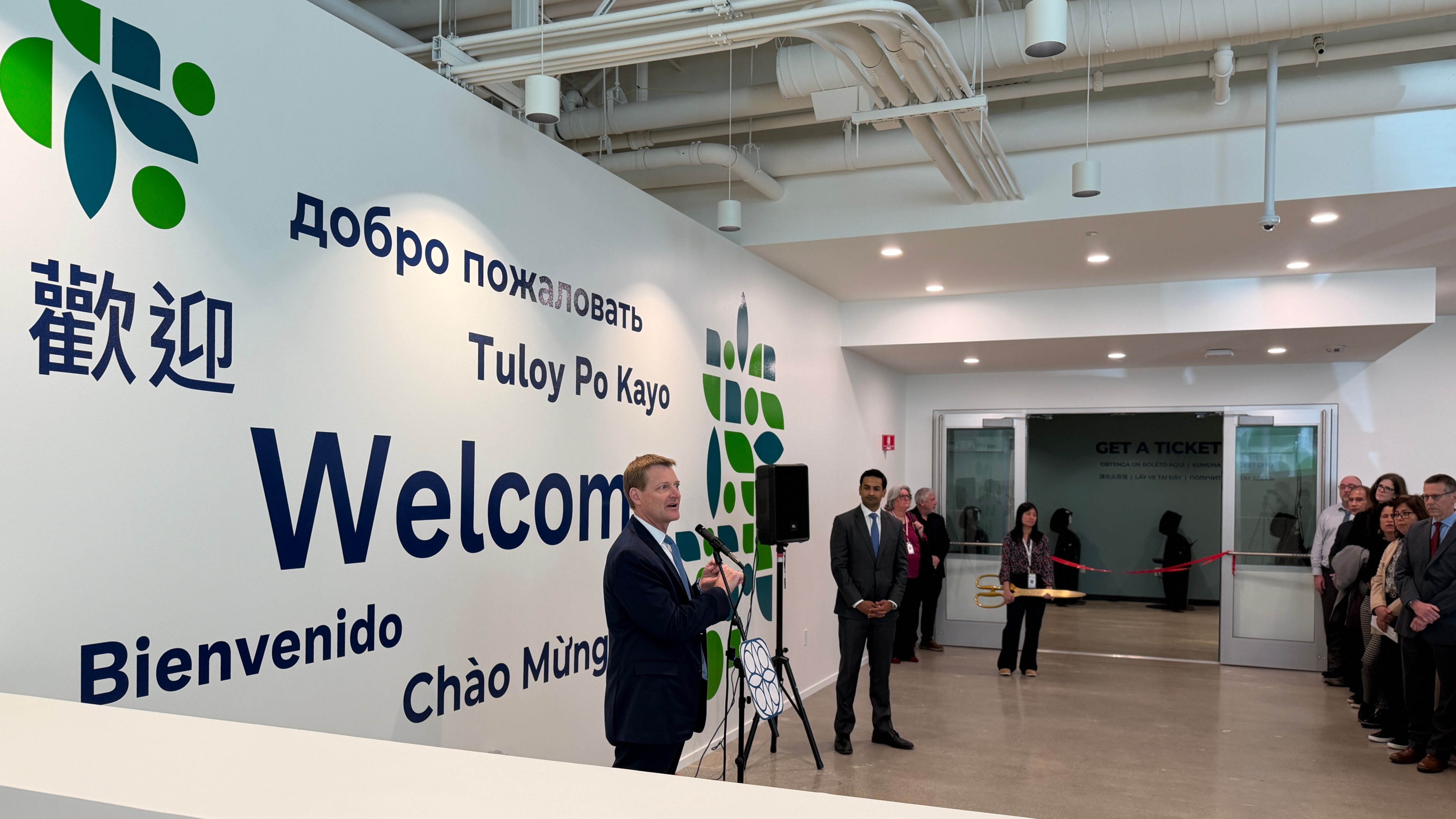 In the grand opening ceremony, Trent Rhorer (speaking), executive director of SFHSA, welcomes visitors to the new Service Center which is equipped with multi-lingual self-service kiosks including Chinese and Spanish. Photo by Portia Li 