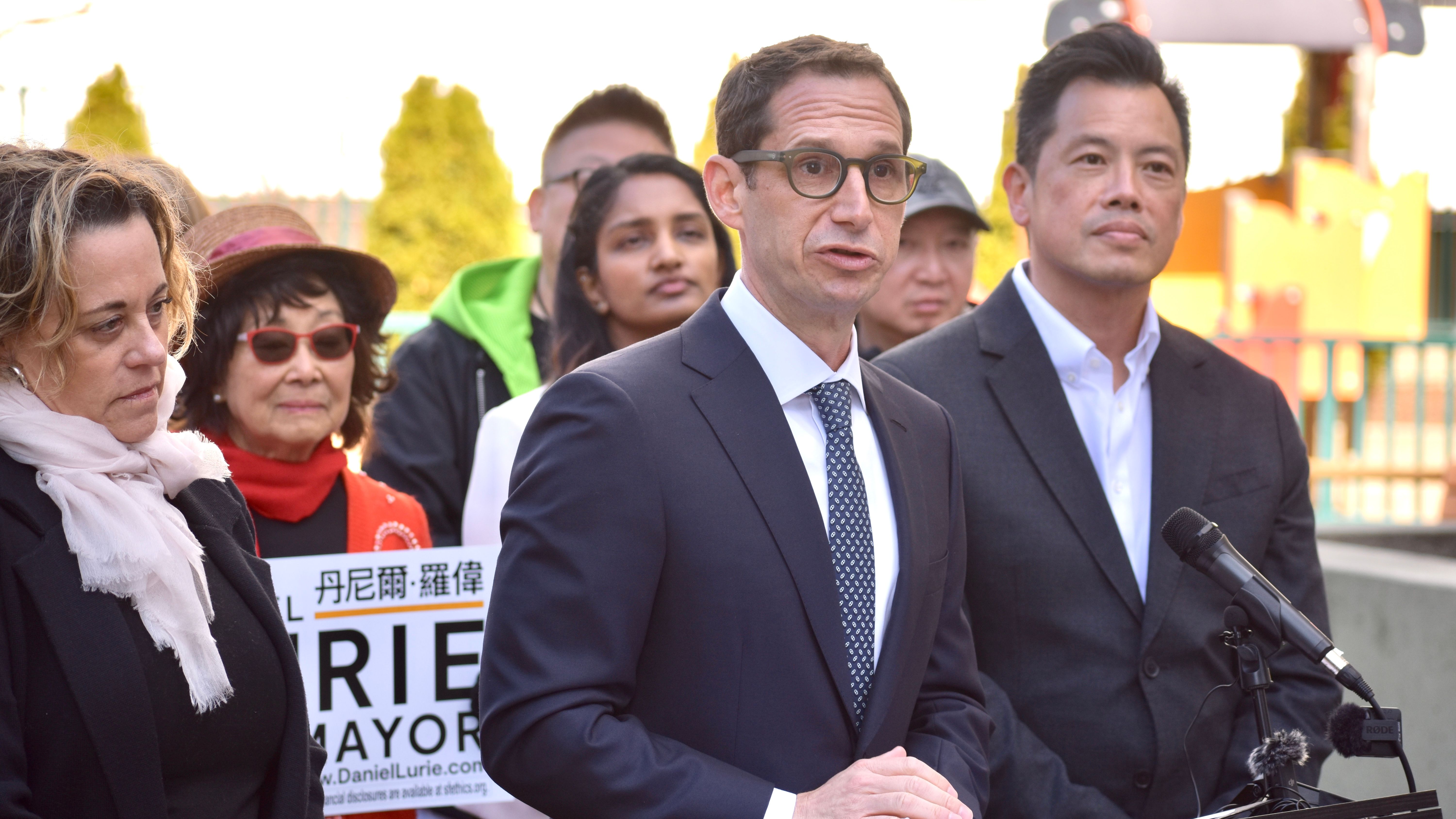 Retired SFPD Commander Paul Yep (first from far right) endorses Daniel Lurie (center) running for mayor in 2024. Photo by Portia Li