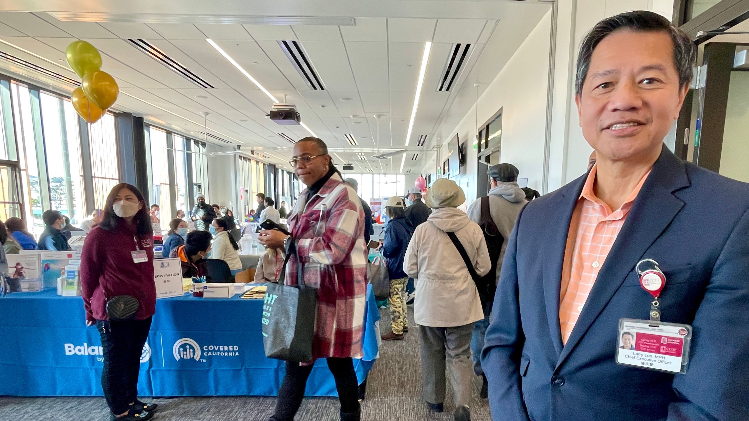 CCHP CEO Larry Loo (right) hopes to connect two largest minority communities, African and Asia Americans, in Bayview by co-hosting a comunity health fair with Covered California. Photo by Portia Li