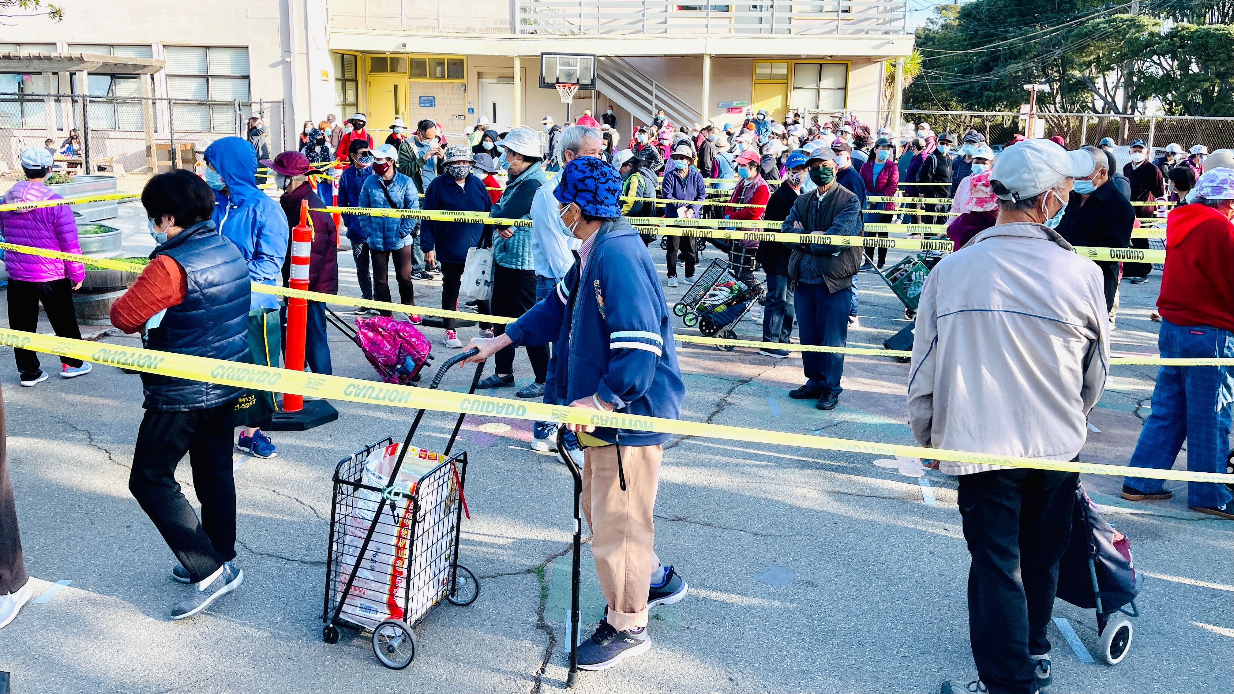 300 seniors were lining up for the healthy food bags in Visitacion Valley. Photo by Portia L