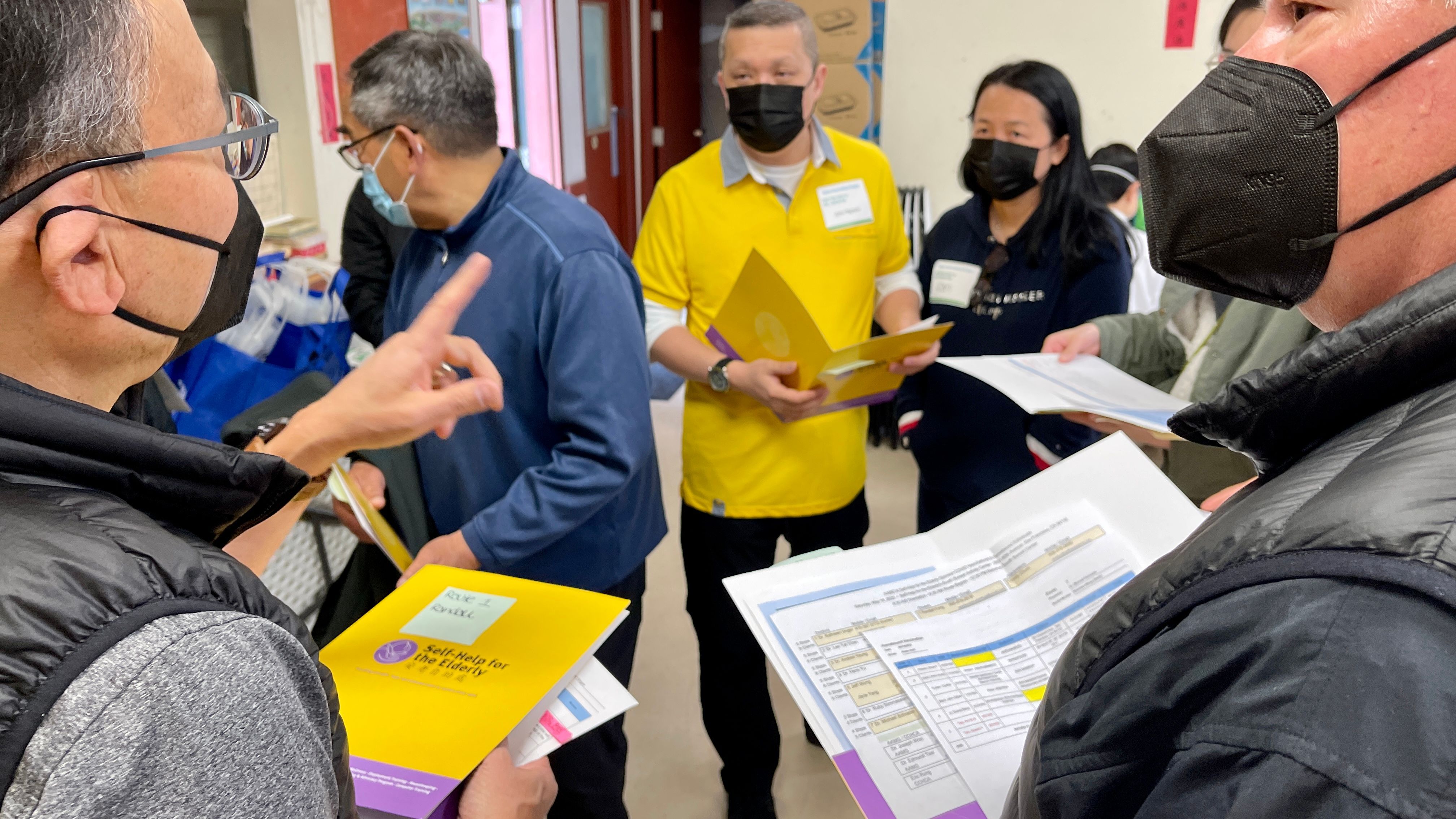 Self-Help for the Elderly members gather the homebound seniors information working with AAMG doctors to provide vaccination services. Photo by Portia Li