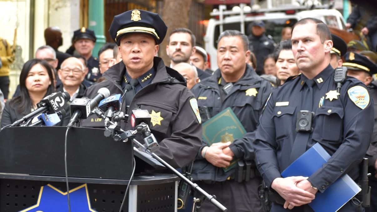 SFPD Police Chief Derrick Lew (center) and Central Police Station Captain Christopher Del Gandio (1st from far right) announce increased police presence across the city during the Lunar New Year celebration in San Francisco. Photo by Portia Li