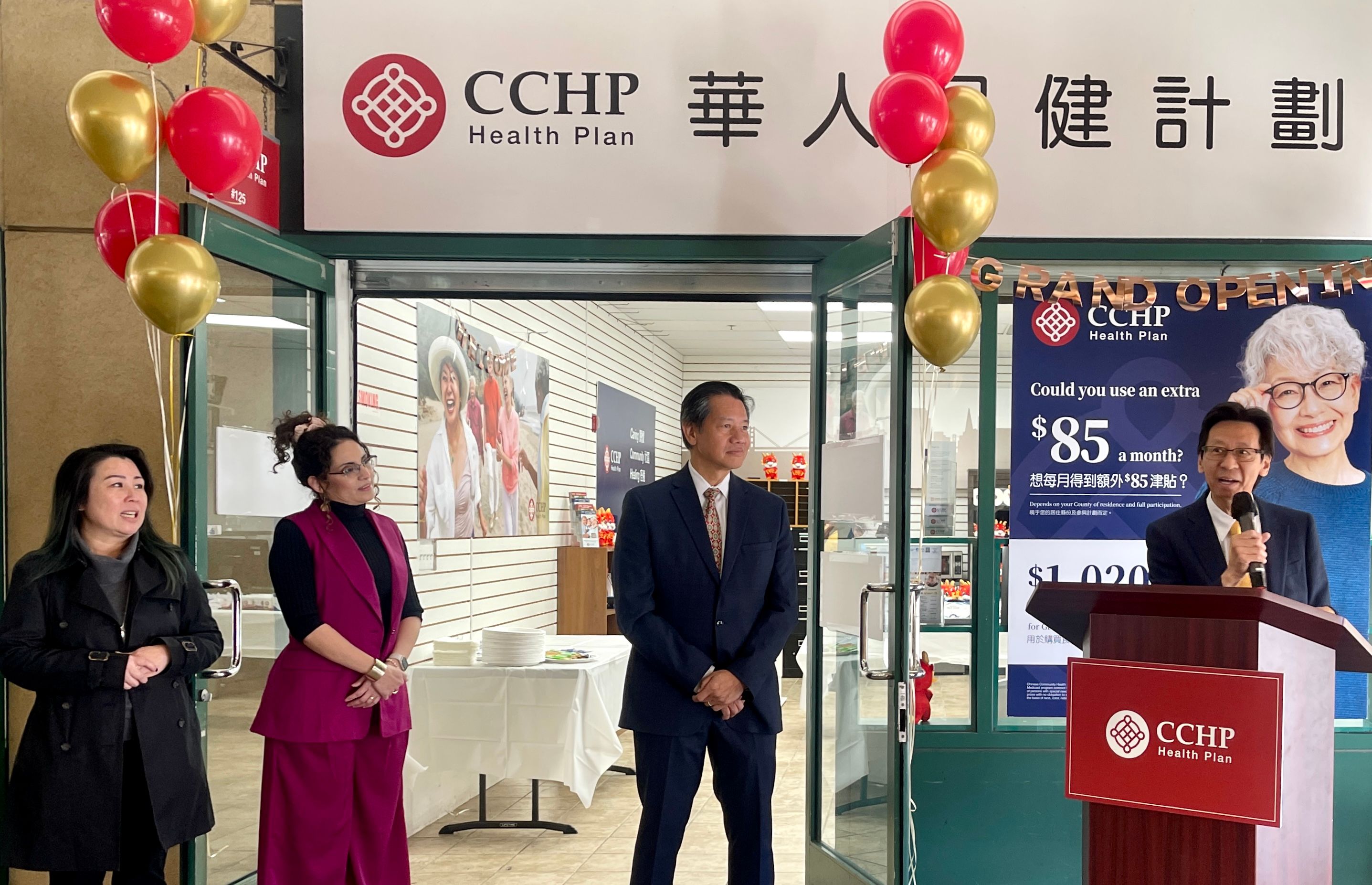 Oakland community leader Carl Chan (first from far right) welcomes CCHP to expand its service to Alameda County and open an office in Oakland Chinatown. CCHP CEO Larry Loo (center) hosts an opening ceremony at the new Oakland office. Photo by Portia Li 