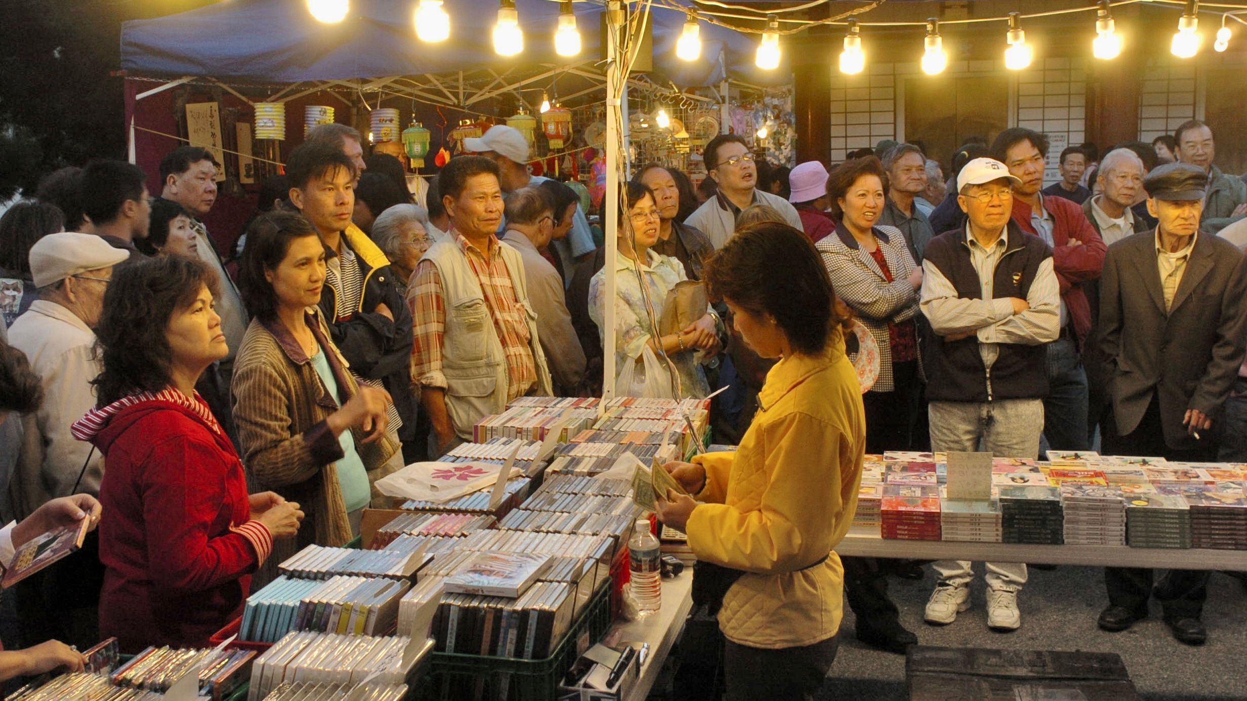 Although Pius Lee was busy in his career, he found time to organize the Chinatown Night Market at Portsmouth Square for 10 years starting 1999. Photo by Ben Kwan