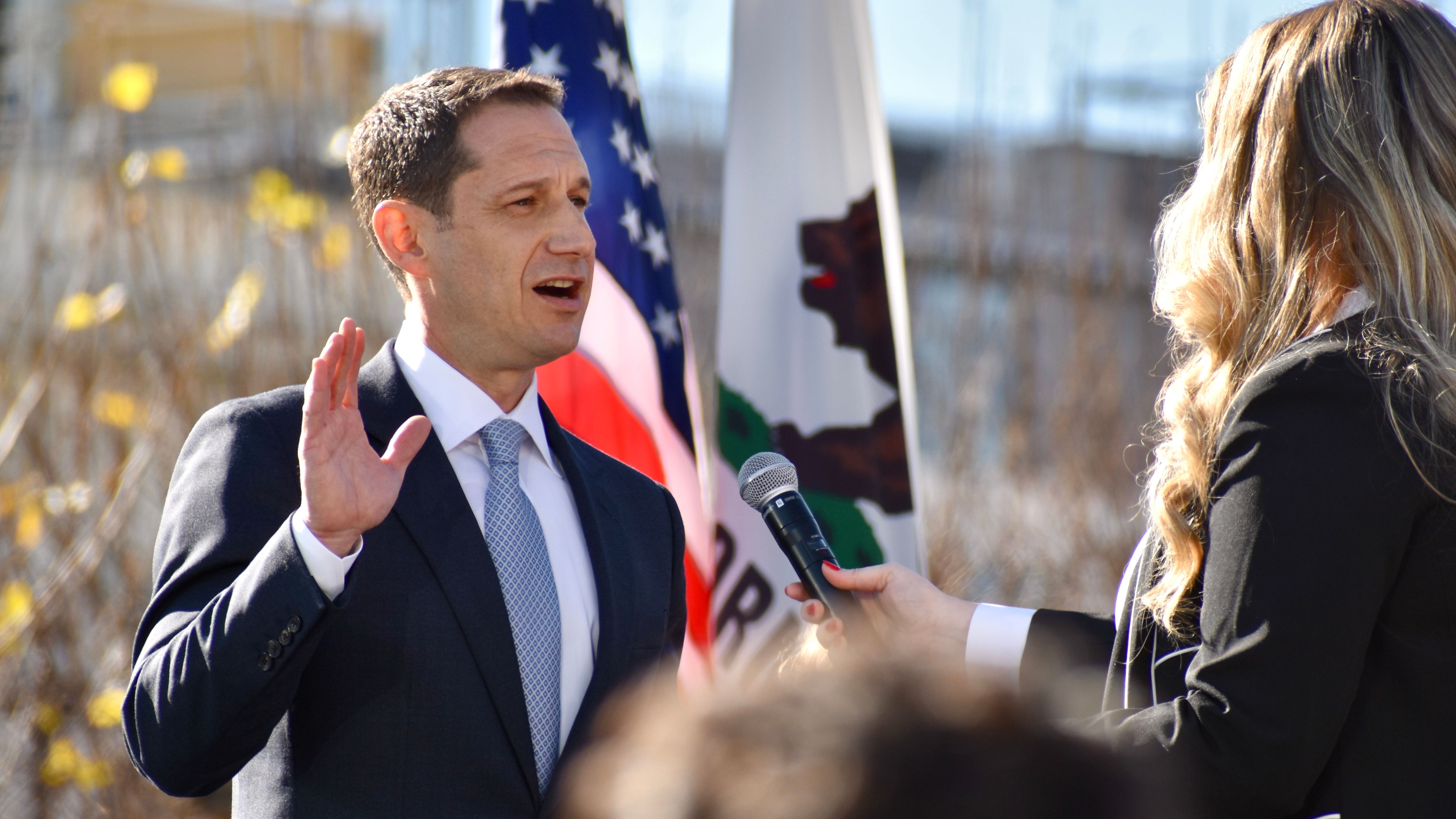 Daniel Lurie (left) is sworn into office by Associate Deputy State Public Defender Jessie Peterson (right) as San Francisco's 46th mayor on January 8, 2025. Photo by Portia Li