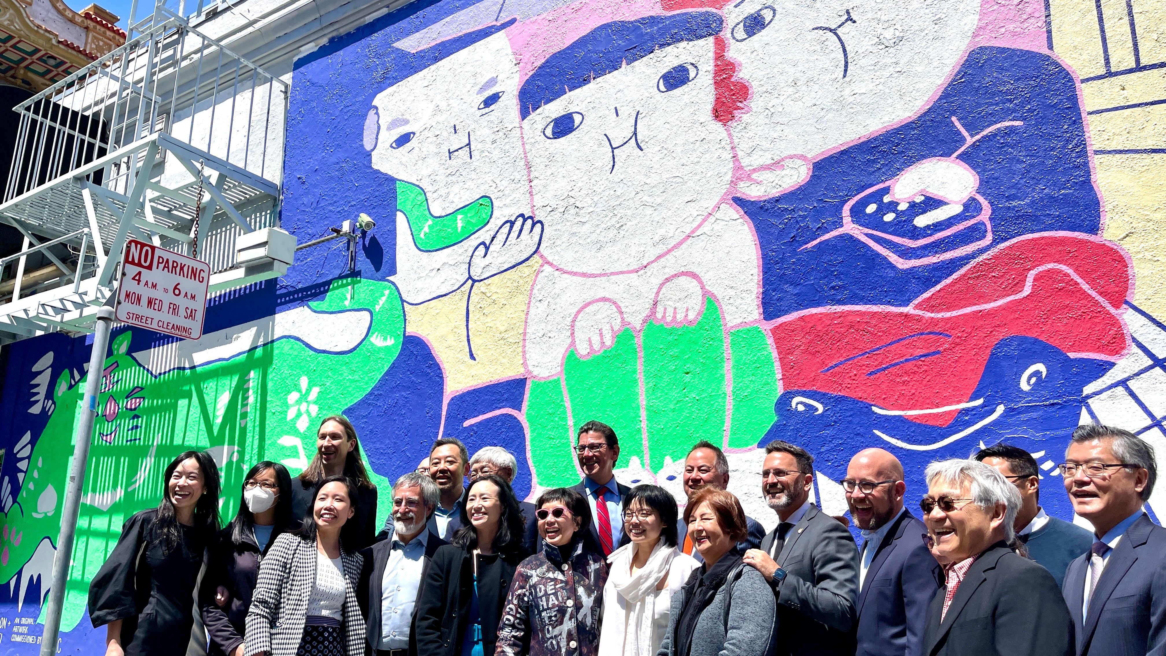 “Edge On the Square”, home of the Chinatown Media and Arts Collaborative (CMAC), is open with newly painted murals. Leaders and artists are excited to join the opening ceremony. Photo by Portia Li