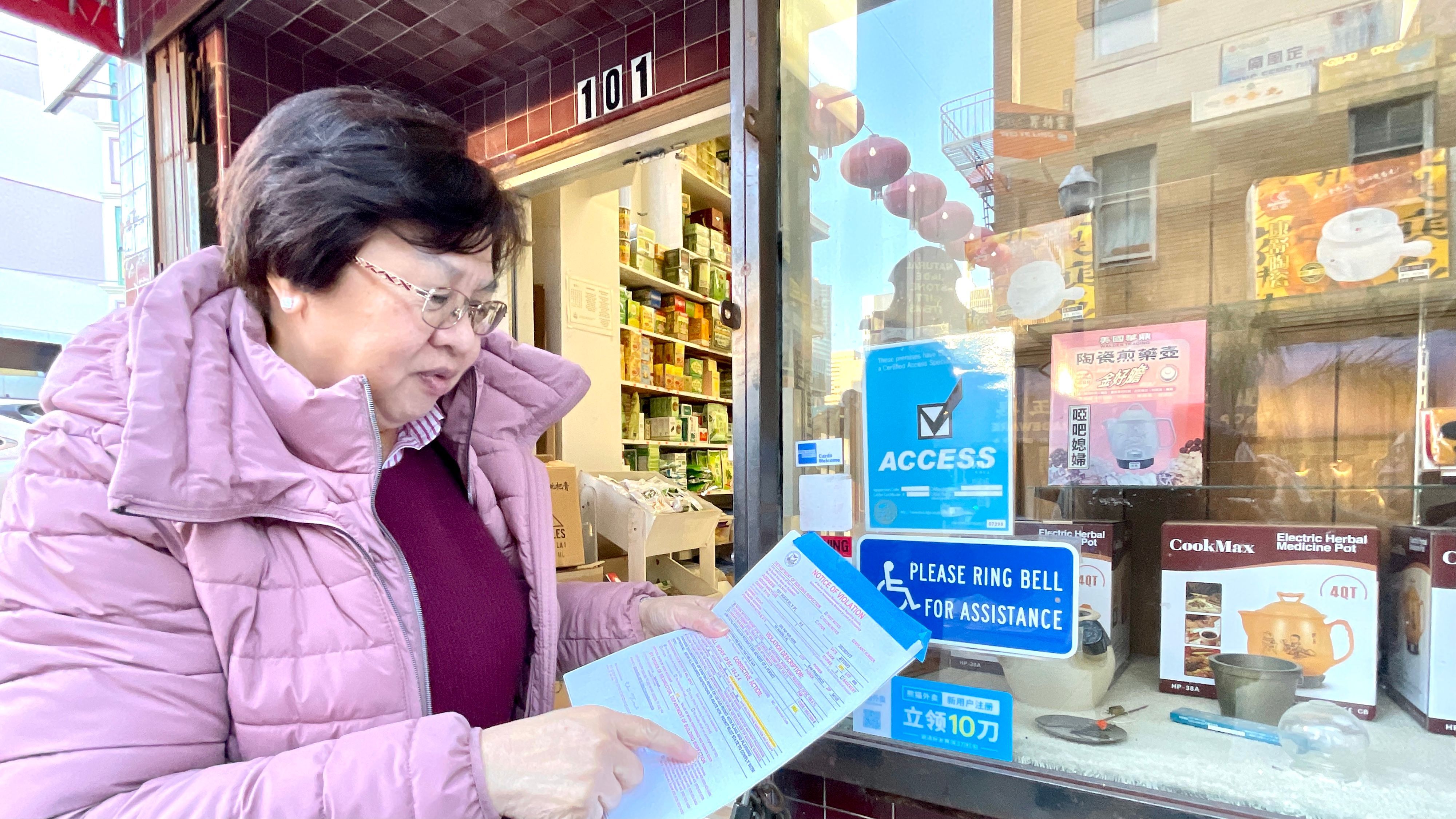 Chinatown small business advocate Lily Lo has been contacted by 30 merchants seeking help on the DBI notices of violations. Photo by Portia Li