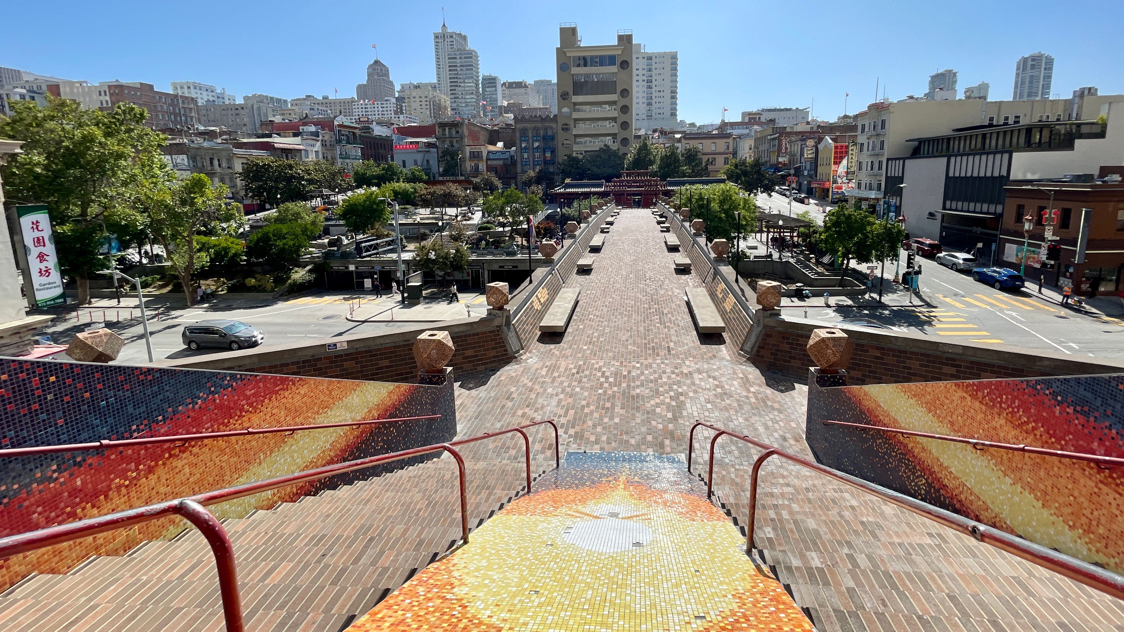 In Chinese Feng Shui practice, a bridge can bring in fortune, prosperity and well-being through connection. For the past 54 years, the Portsmouth Square pedestrian bridge has been a good Feng Shui bridge connecting San Francisco Chinatown to the Financial District. The plan approved by the city to renovate Portsmouth Square includes the removal of the pedestrian bridge. Photo by Portia Li