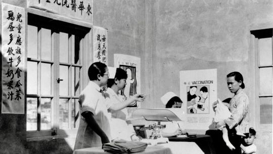 A Chinese American physician and nurses were in the Interior of Babies Aid Clinic in Chinese Hospital in 1933 to see baby patients. Courtesy San Francisco History Center, San Francisco Public Library