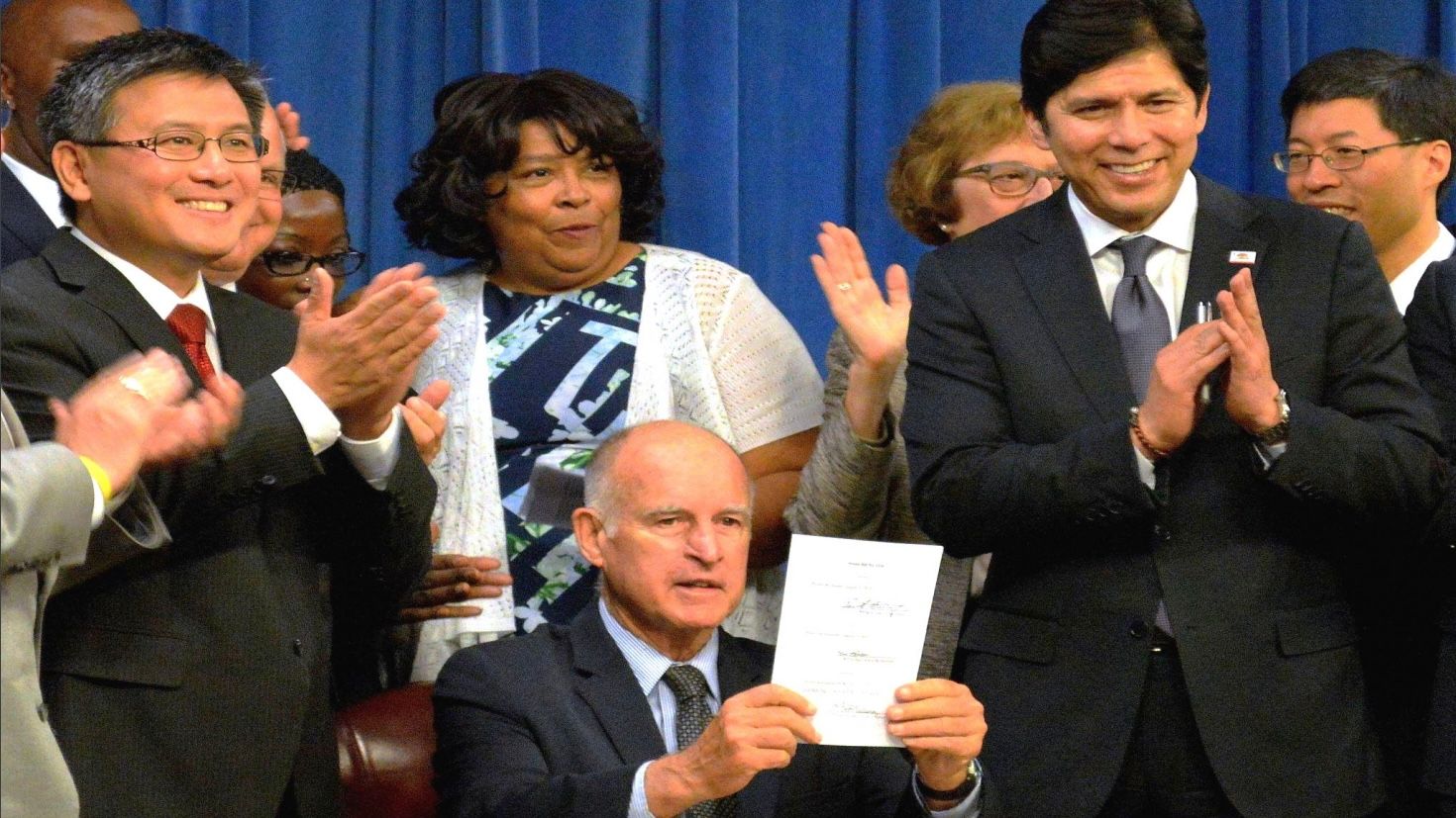 California Senate Bill 1234 was co-authored by then State Senate President Pro Tem Kevin De Leon (right in front row) and former California State Treasurer John Chiang (left in front row) in 2012. Former Governor Jerry Brown (center) signed SB 1234 into law in 2016. The legislation mandates all employers in California to offer retirement savings plans for all private sector employees. Courtesy California Governor’s Office in 2016