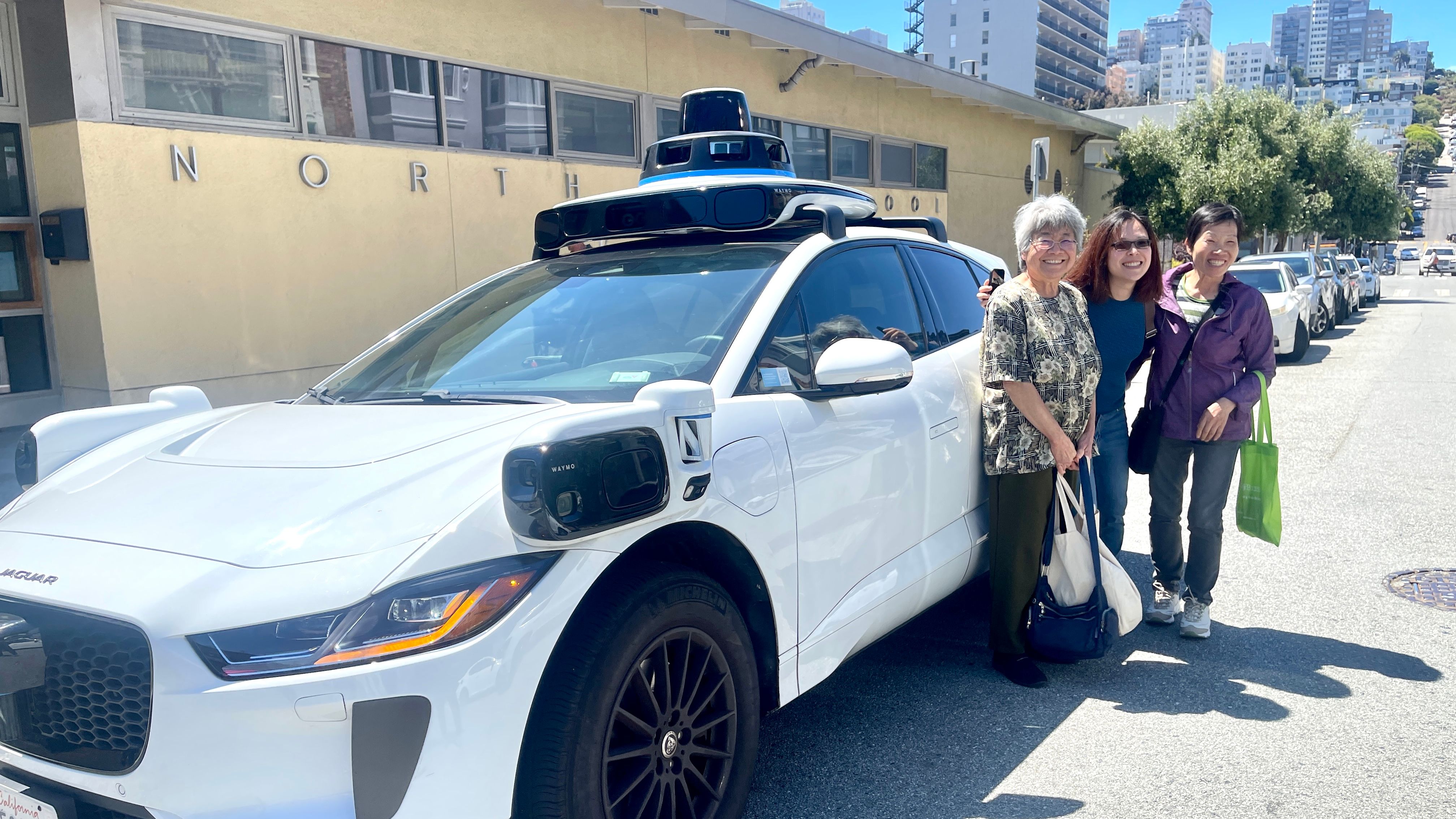 It is the first time for the seniors to ride in a Waymo car. They  agree that they feel safe by riding in person with actual experience to learn about the operations in the robotaxi.  Photo by Portia Li