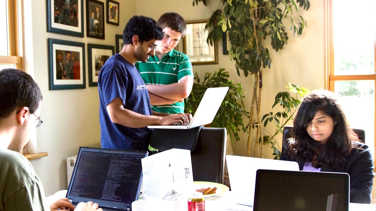 Saikat Chakrabarti (in navy T-shirt) was standing with John Collison, co-founder of payment-processing Stripe, looking at the laptop. Sheena Pakanati (1st on far right sitting) who co-founded Mockingbird with Chakrabarti also followed him to join Stripe in early days. This photo was taken at Collison’s parent's house in Ireland where they did their first "retreat." Courtesy Saikat Chakrabarti