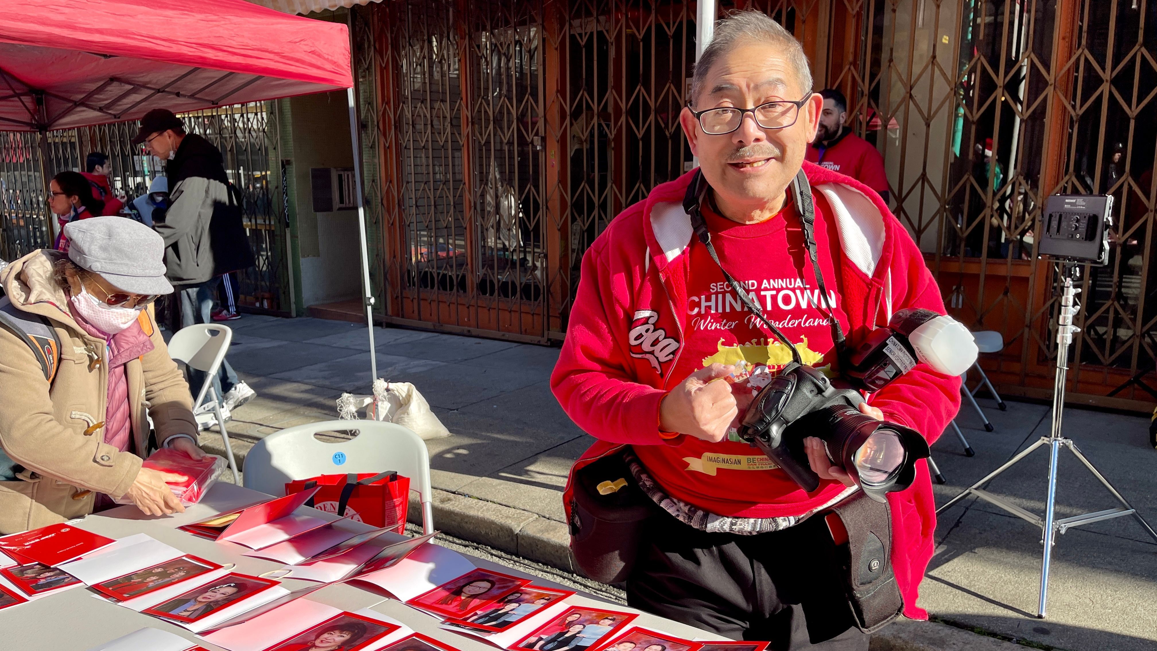 Frank Jang has provided the popular portrait services for free at Chinatown street fairs  since 2015. Photo by Portia Li