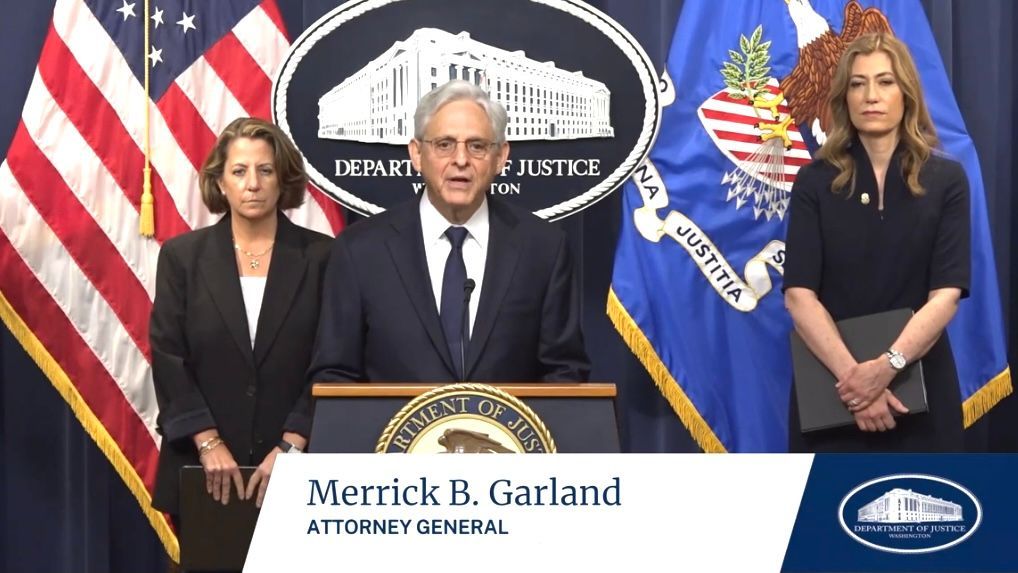 Merrick Garland (center) announces on June 23 in Washington, D.C. the charges against 4 China-based chemical manufacturing companies and 8 executives for fentanyl manufacturing. Screenshot