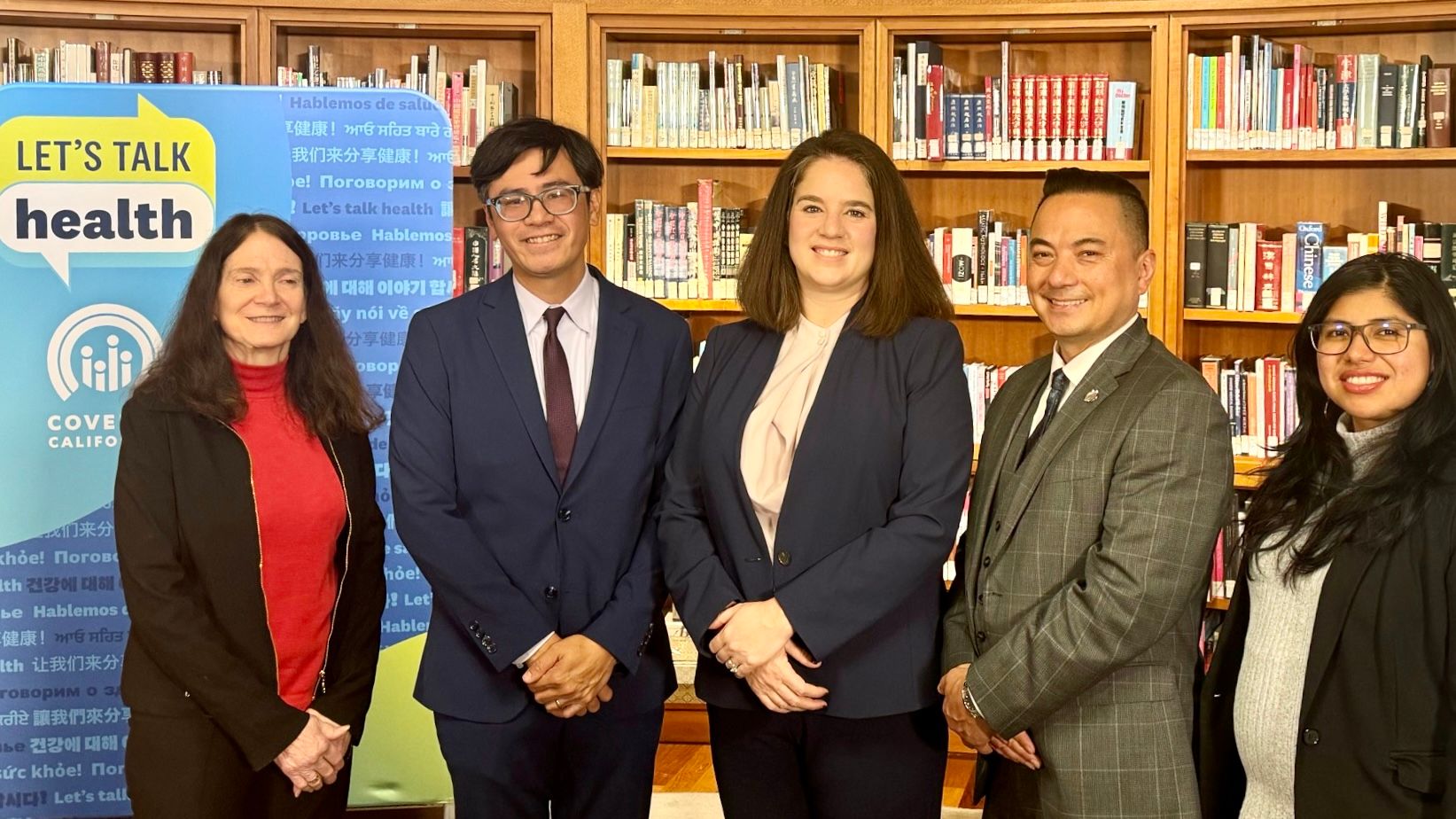 In San Francisco Main Library, Covered CA Executive Director Jessica Altman (center) is joined by City Librarian Michael Lambert (2nd from far right), Clinical Professor of Community Health Sciences Linda A Neuhauser (1st from far left), and Asian Inc. Executive Director Lamar Heystek (2nd from far left) to encourage Californians signing up for health insurance plans via Covered CA. Courtesy photo