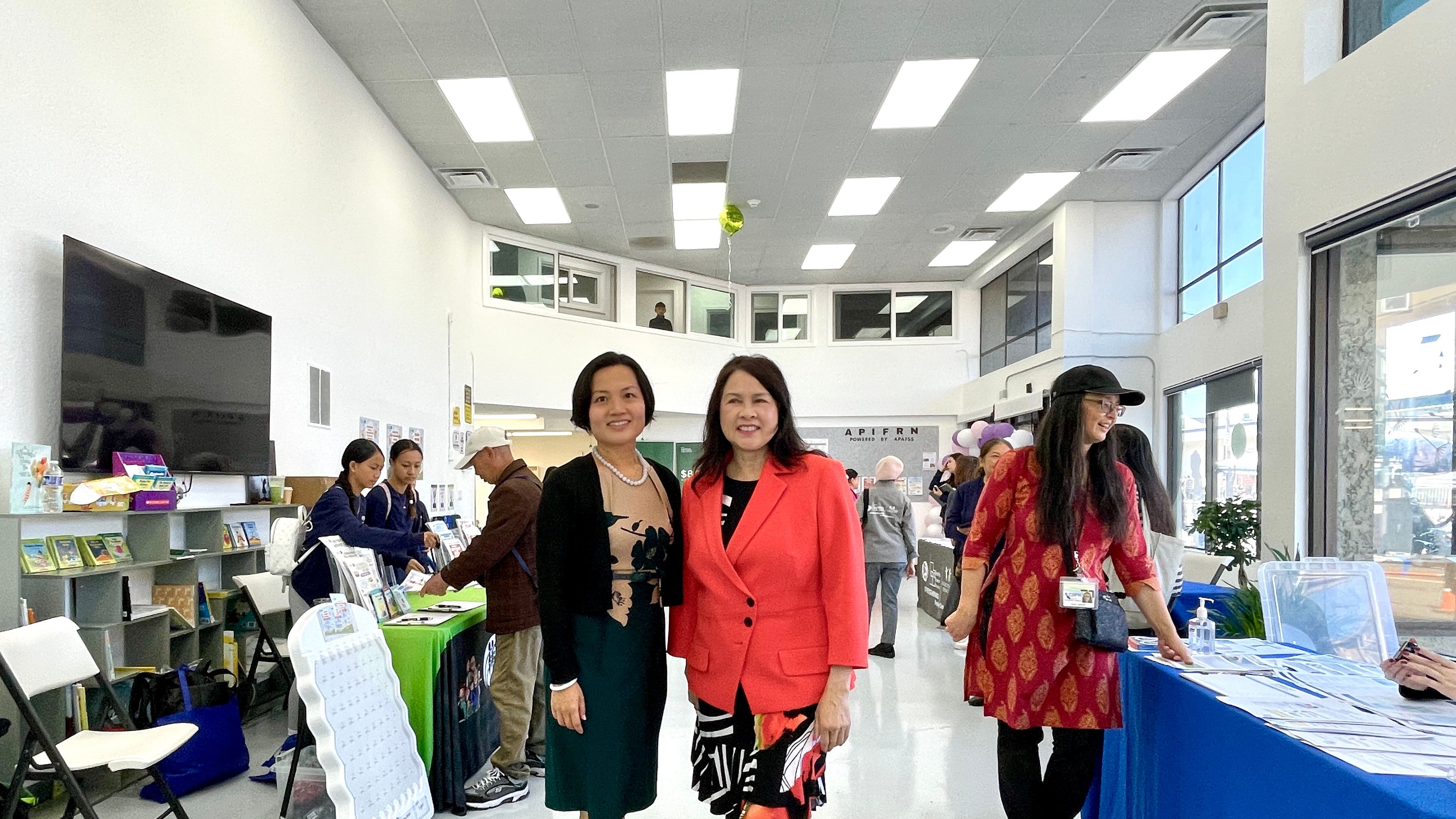APA Family Support Services (APAFSS) holds an open house and opening ceremony for the newly-acquired Excelsior Resource Center. Executive Director Fanny Lam (left) and Board Chair Rose Chung (right) stand in the main lobby of the spacious Excelsior Center which includes a mezzanine level of offices. Photo by Portia Li