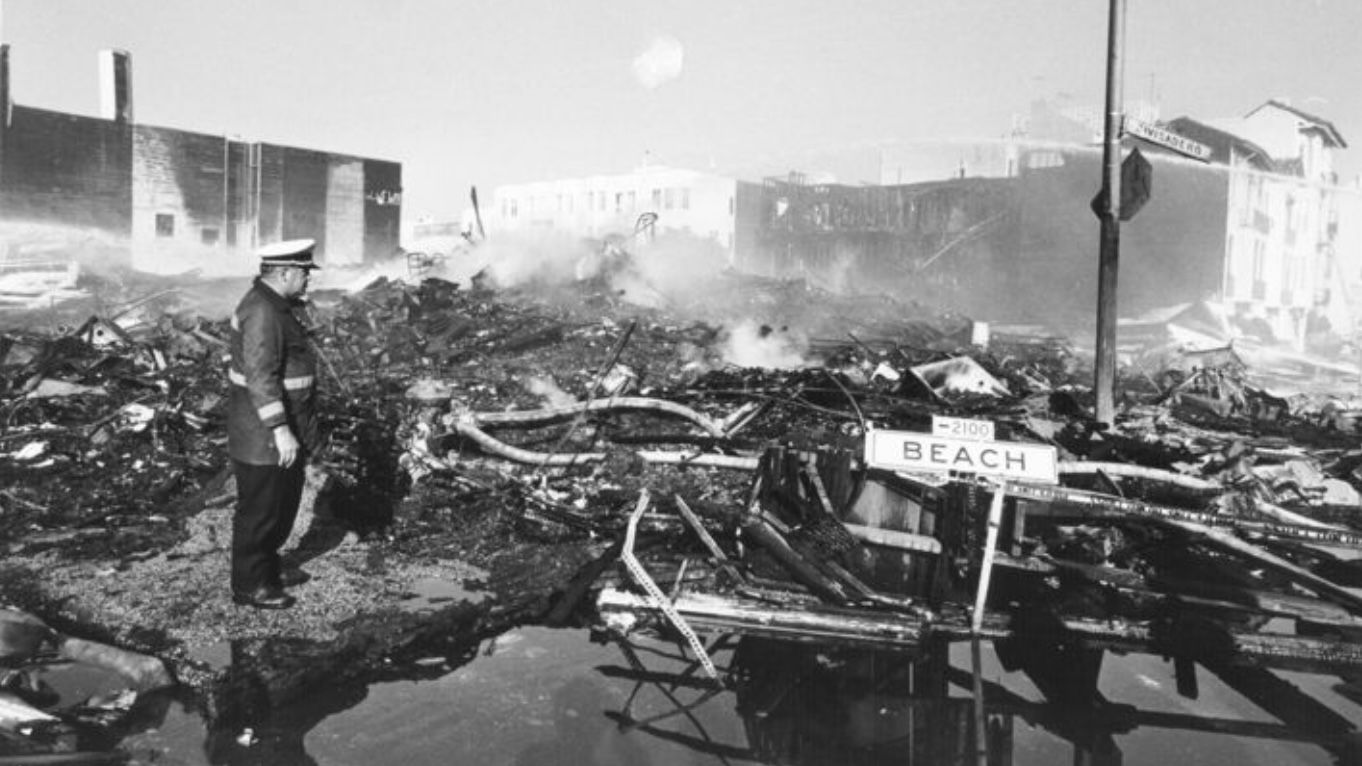 A firefighter was at an extinguished fire scene in Marina District after the Loma Prieta earthquake hit San Francisco in 1989. Courtesy San Francisco Public Library